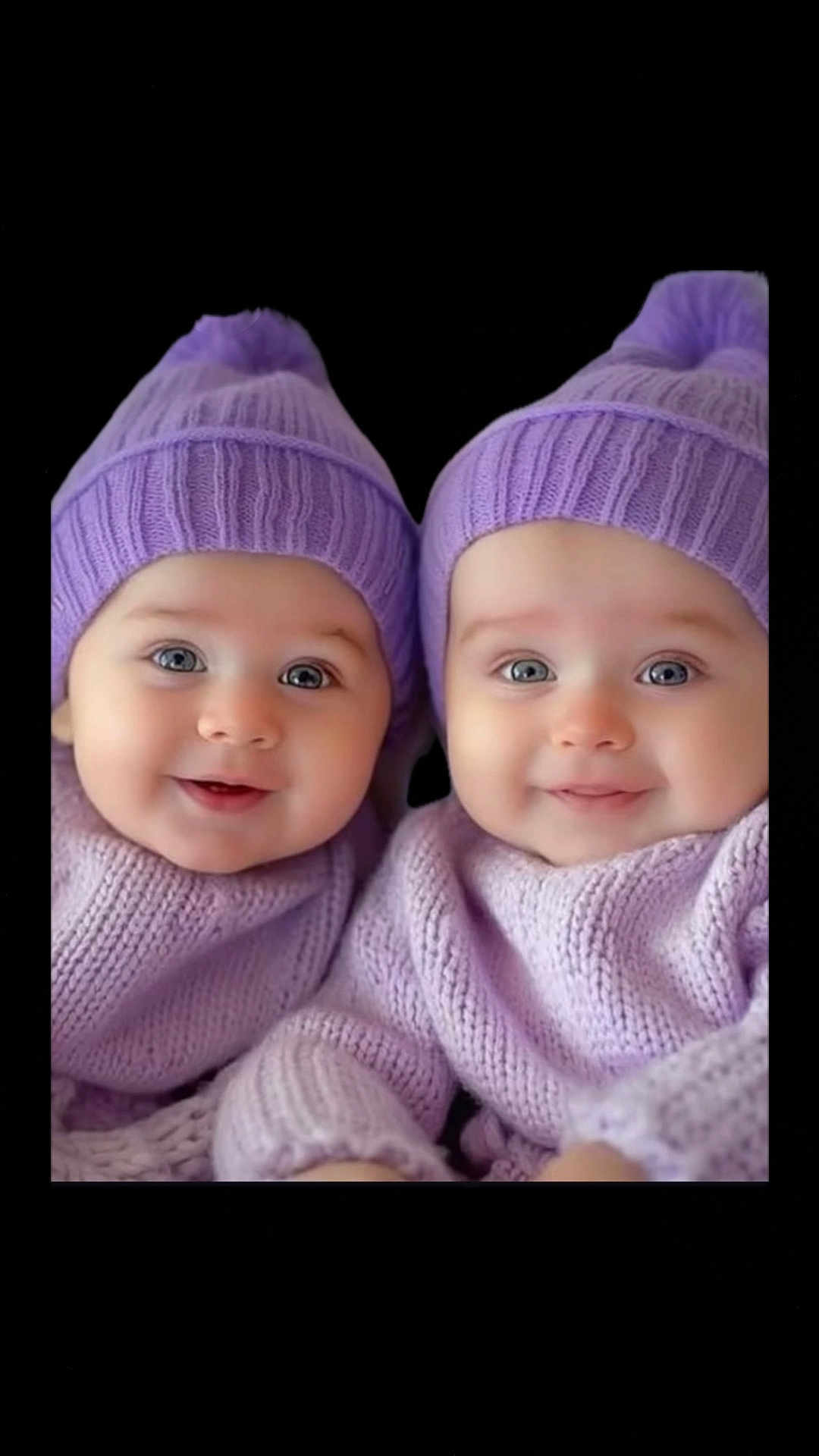 Arfa joined the competition — help win amazing prizes! baby, twin_babies, purple_hat, purple_sweater, smiling, cute, infant, knitwear, portrait, closeup, child, face, blue_eyes, soft_lighting, warm_clothing, adorable, happy, indoor, two_children, black_background