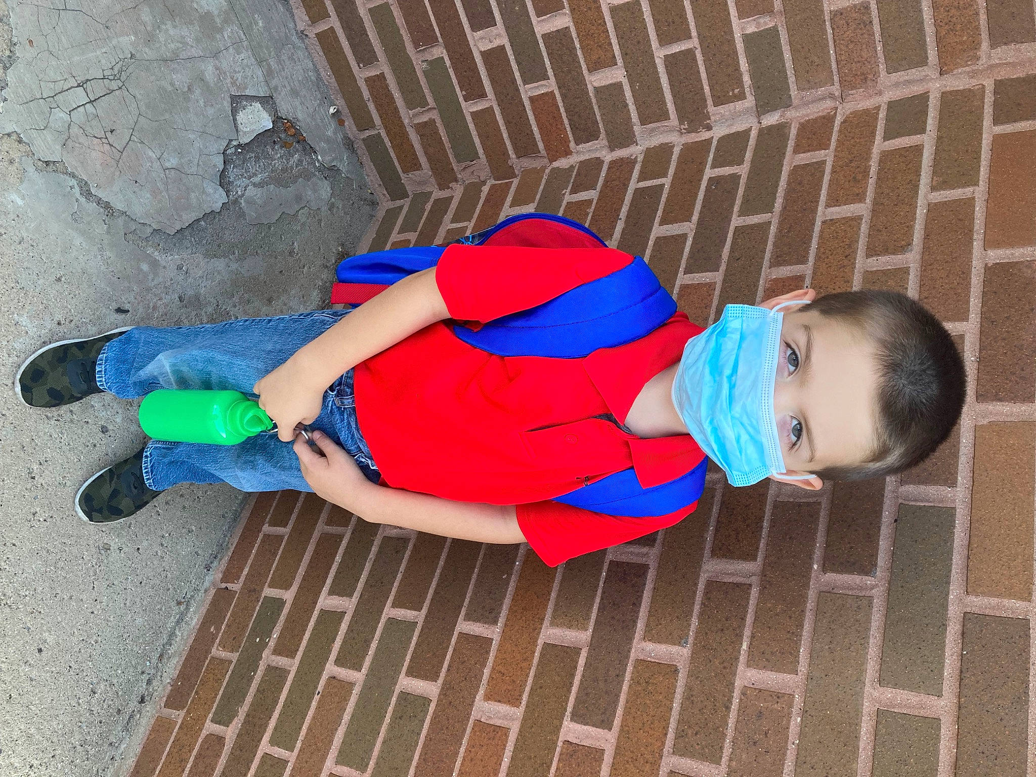 Nathan is registered to the contest to win money with this photo: baby_toddler_clothing, child, electric_blue, flooring, footwear, fun, hat, human_body, human_leg, leg, leisure, pattern, person, personal_protective_equipment, play, red, sitting, sleeve, t_shirt, thigh