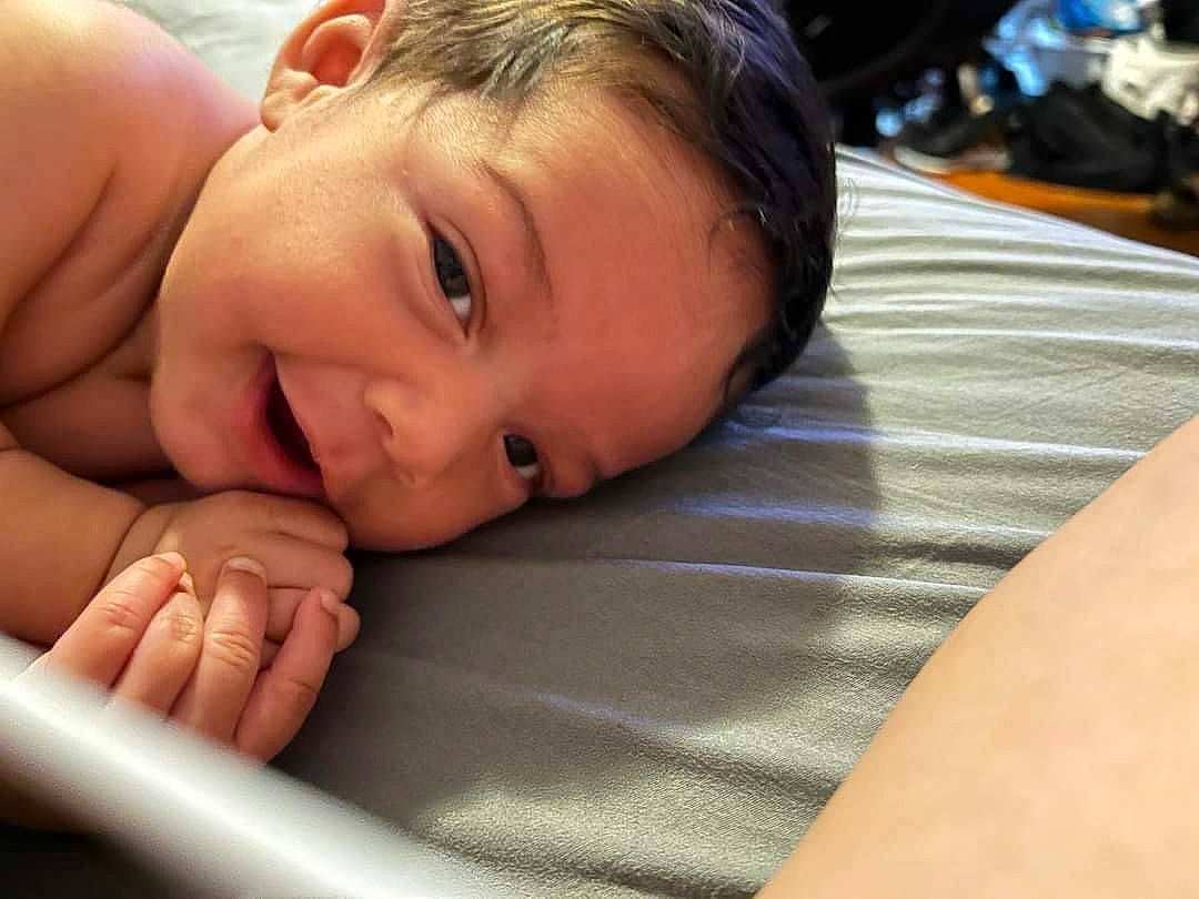 Ymir is registered to the contest to win money with this photo: cheek, chest, child, chin, close_up, comfort, elbow, eye, eyebrow, eyelash, gesture, hair, happy, head, linens, mouth, nose, person, skin, smile