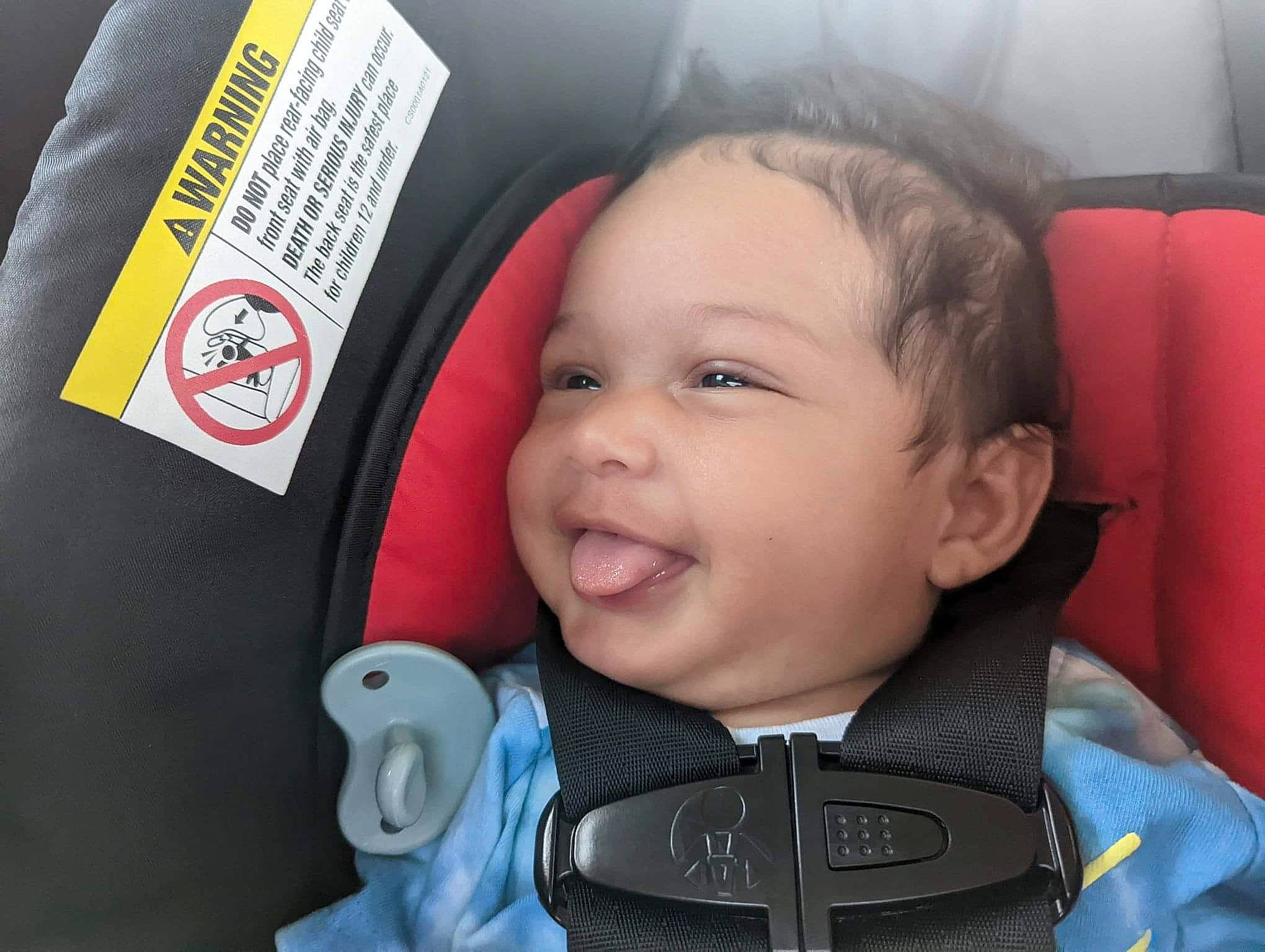 Ymir is registered to the contest to win money with this photo: auto_part, baby, baby_carriage, baby_in_car_seat, baby_products, baby_toddler_clothing, car_seat, carmine, cheek, child, comfort, electric_blue, finger, happy, nose, person, product, seat_belt, smile, toddler