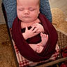 newborn, baby, sleeping, wrapped, blanket, pillow, chair, cushion, woven_mat, flowers, indoors, portrait, peaceful, hands, feet, soft_light, photography, cozy, cute, resting
