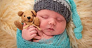 Oliver joined the competition — help win amazing prizes! newborn, baby, sleeping, knitted_hat, teddy_bear, blanket, wrapped, soft_background, closeup, infant, cute, peaceful, portrait, child, tiny_hands, cozy, warm, fabric, plush, resting