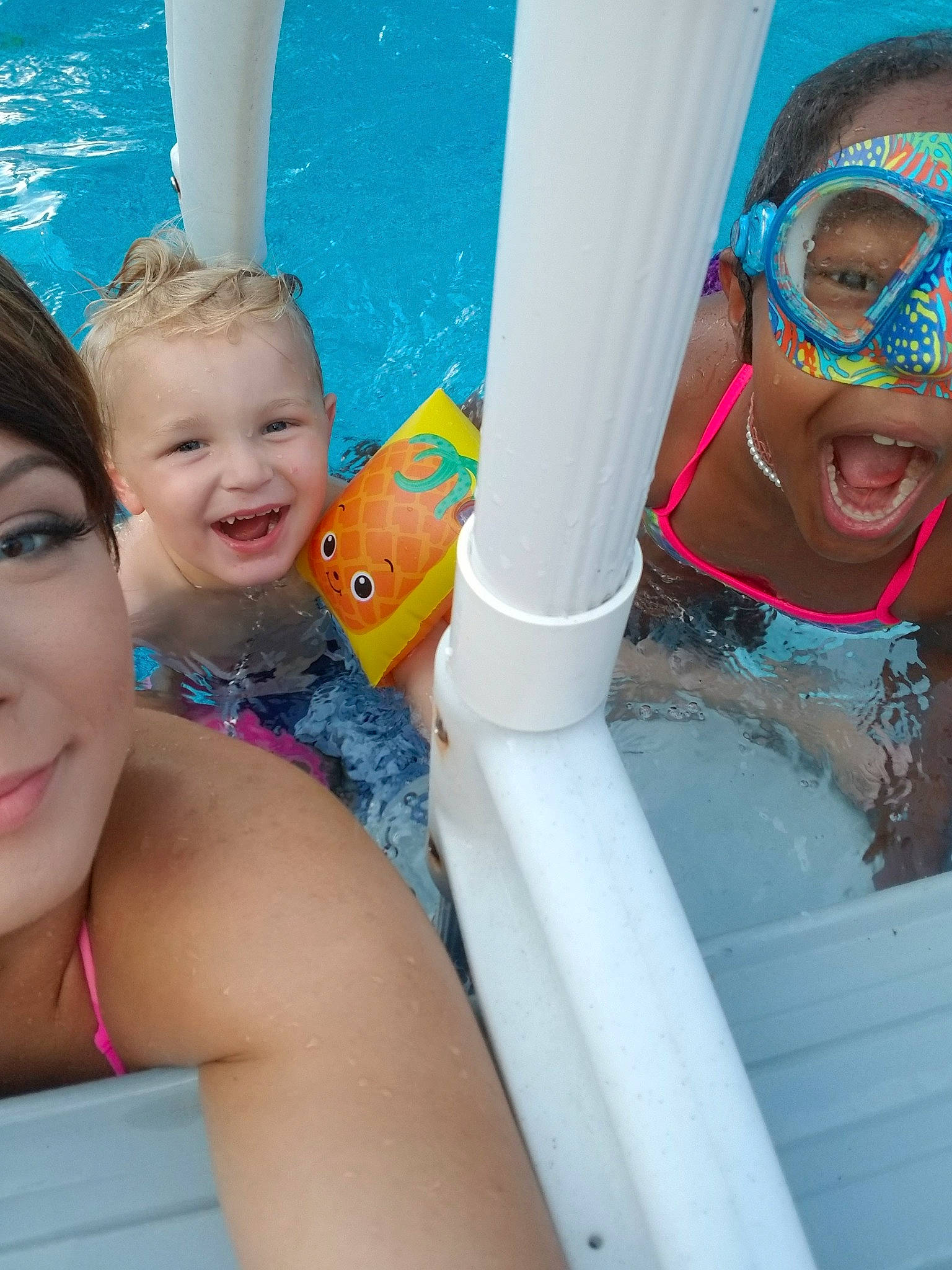 William is registered to the contest to win money with this photo: child, face, fun, games, happy, joy, leisure, neck, nose, person, personal_protective_equipment, photography, play, product, recreation, skin, smile, summer, swimming_pool, toddler