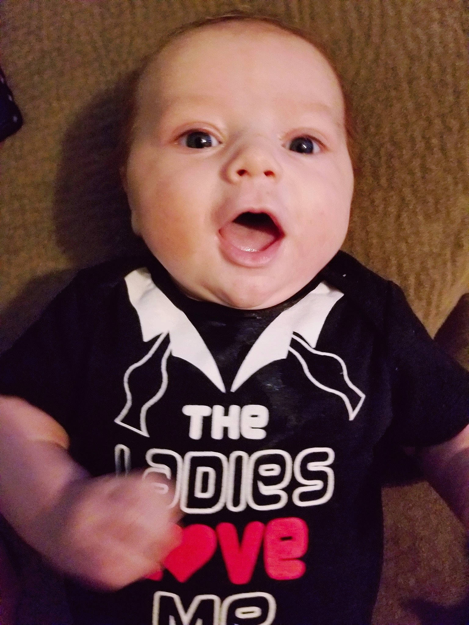 Ethan is registered to the contest to win money with this photo: baby, baby_laughing, baby_toddler_clothing, cheek, child, chin, cool, face, facial_expression, happy, head, laugh, lip, mouth, person, skin, sleeve, smile, surprise, t_shirt
