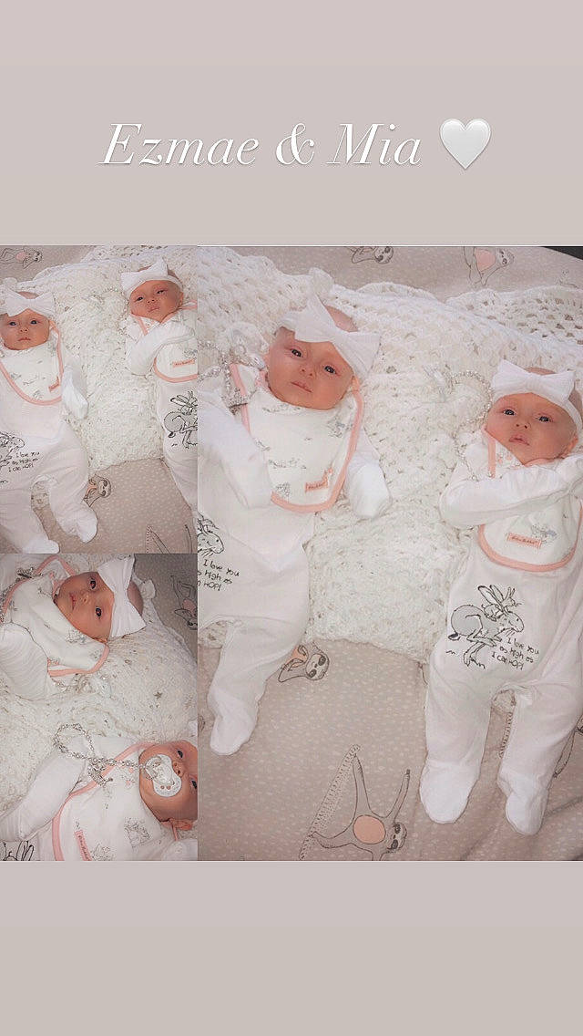 Mia is registered to the contest to win money with this photo: baby, baby_toddler_clothing, circle, font, gesture, happy, headwear, organism, pattern, peach, person, petal, pink, sleeve, textile