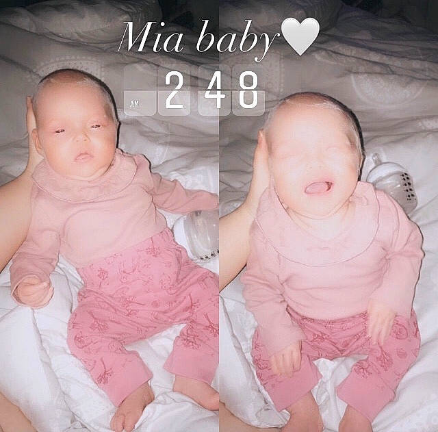 Mia is registered to the contest to win money with this photo: baby, baby_toddler_clothing, cheek, comfort, facial_expression, finger, gesture, happy, head, human_body, leg, mammal, mouth, nose, organ, person, product, skin, sleeve, stomach