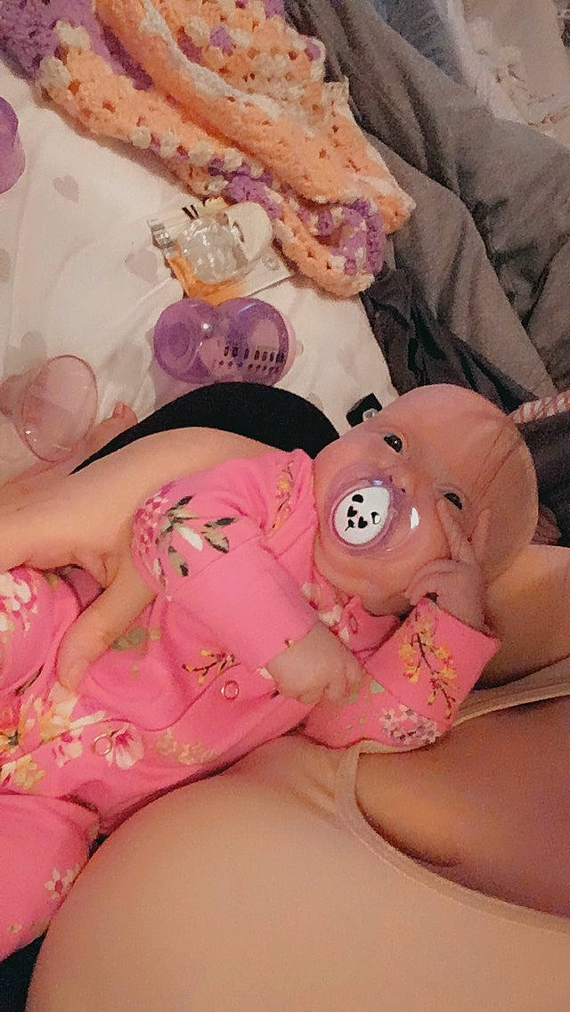 Ezmae is registered to the contest to win money with this photo: abdomen, chest, child, comfort, finger, food, human_body, human_leg, joint, knee, leg, mouth, muscle, nail, person, pink, skin, teddy_bear, textile, thigh