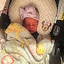 Raylynn is registered to the contest to win money with this photo: newborn, baby, sleeping, blanket, car_seat, hat, bow, plush, face, child, infant, cute, cozy, soft, resting, head_support, comfort, mickey_mouse, indoor, peaceful