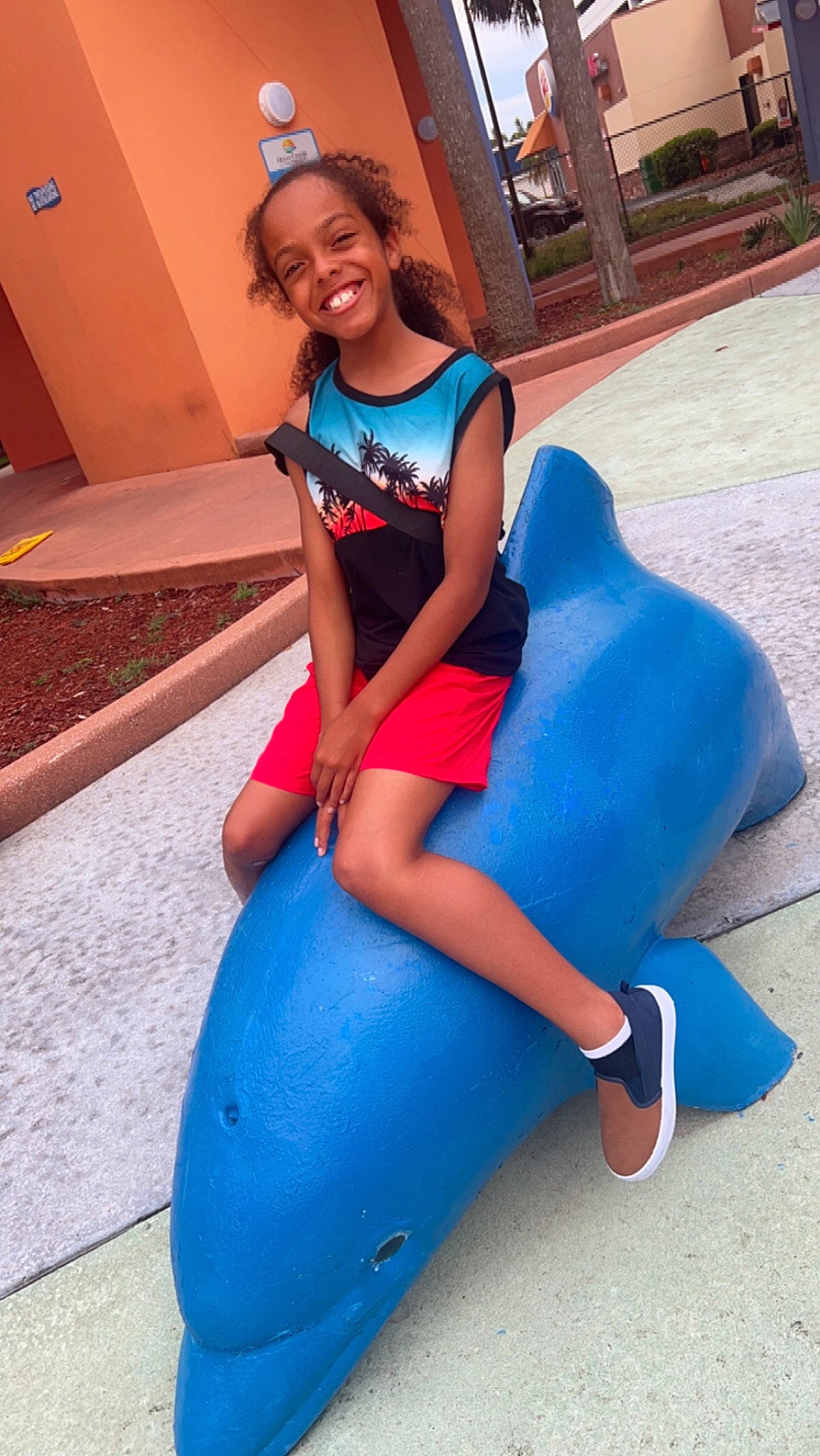 Amar is registered to the contest to win money with this photo: abdomen, blue, child, costume, electric_blue, fun, happy, human_body, human_leg, joy, knee, lap, leisure, magenta, person, recreation, sitting, smile, spandex, sportswear