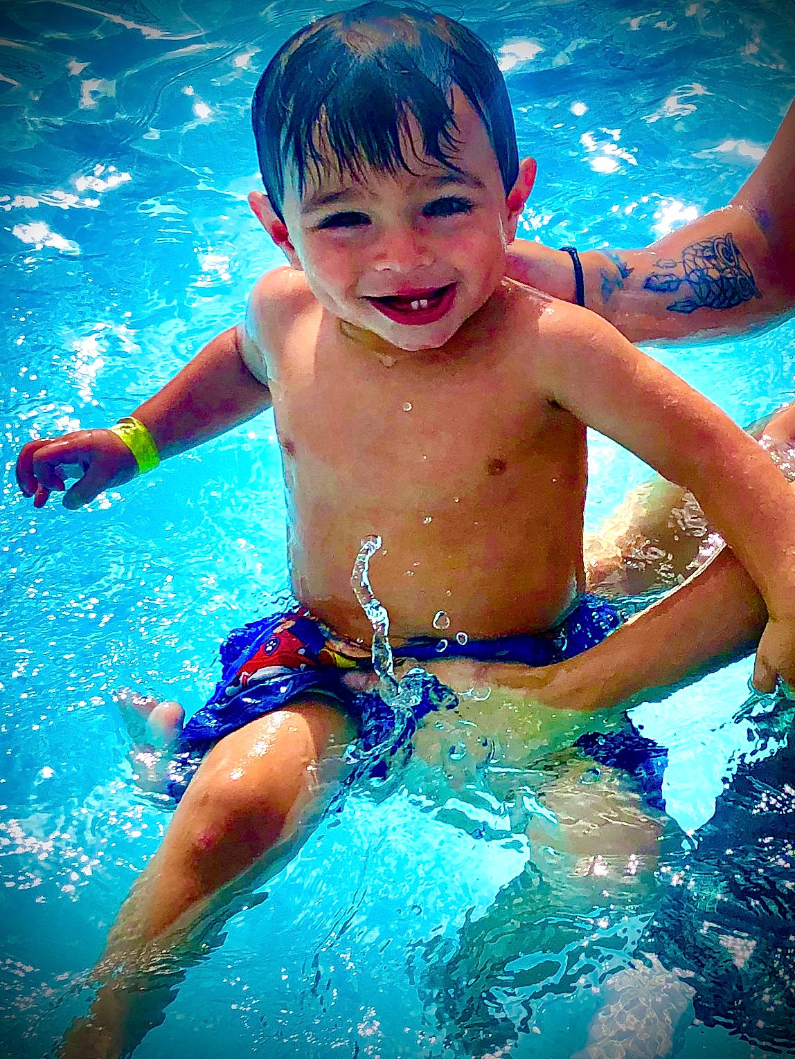 Quinten is registered to the contest to win money with this photo: chest, child, facial_expression, fun, games, happy, joy, leisure, leisure_centre, park, person, play, recreation, smile, summer, swimmer, swimming, swimming_pool, toddler, vacation