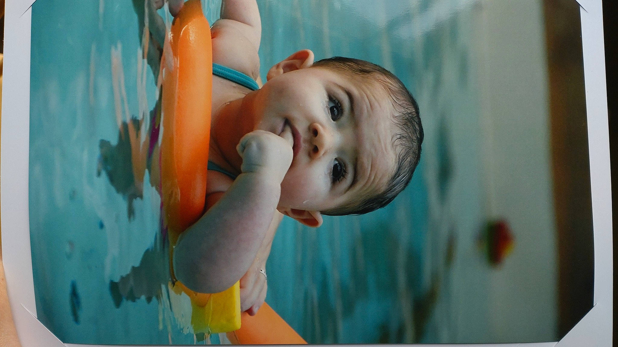 Soledad participe au concours pour gagner de l'argent avec cette photo : aqua, azure, baby, baby_toddler_clothing, cheek, child, flash_photography, fun, gesture, hand, happy, human_body, iris, leisure, lip, nose, person, product, rectangle, smile