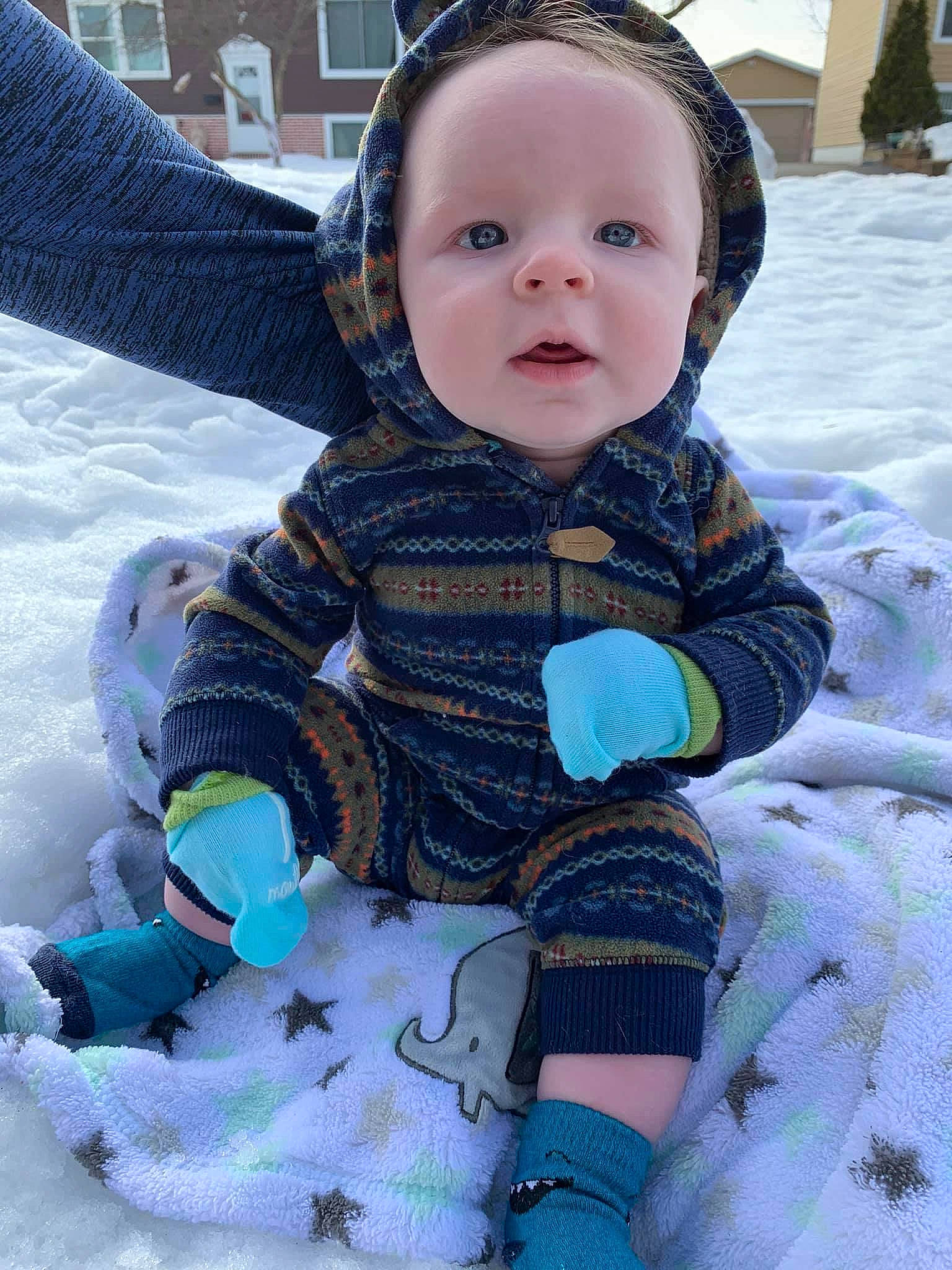 Jaxton is registered to the contest to win money with this photo: baby, baby_products, baby_toddler_clothing, cheek, child, comfort, electric_blue, freezing, fun, grass, happy, pattern, person, play, sitting, skin, sleeve, snow, toddler, white