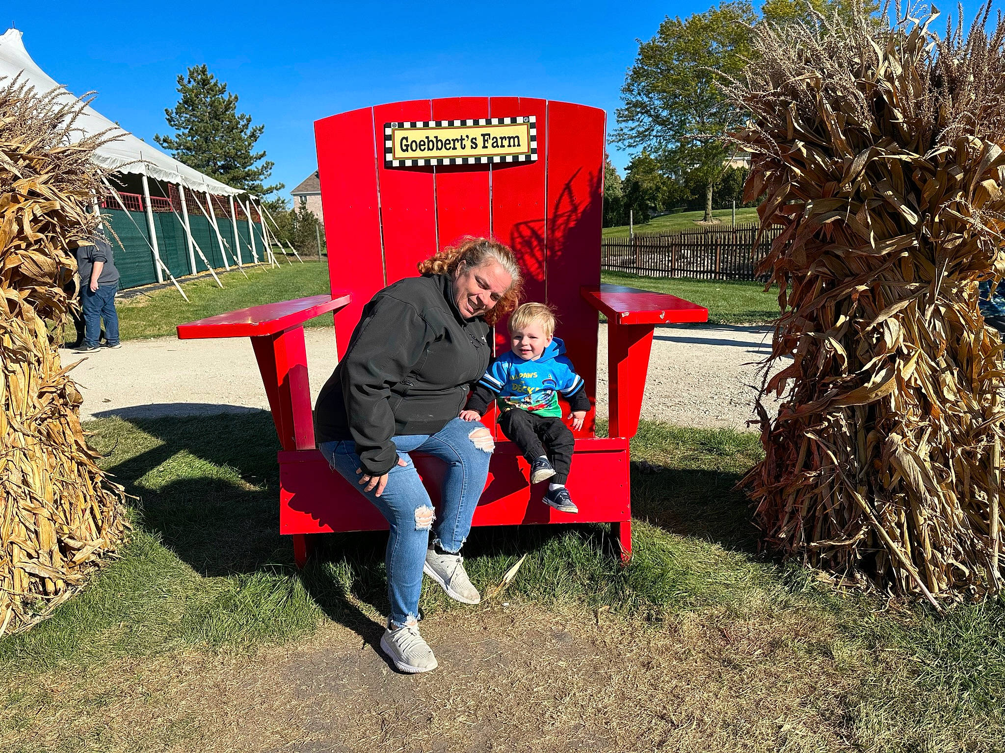 Jaxton is registered to the contest to win money with this photo: agriculture, city, event, fun, grass, grassland, human_settlement, joy, landscape, lawn, leaf, leisure, outdoor_furniture, people_in_nature, person, plant, public_space, recreation, sky, soil