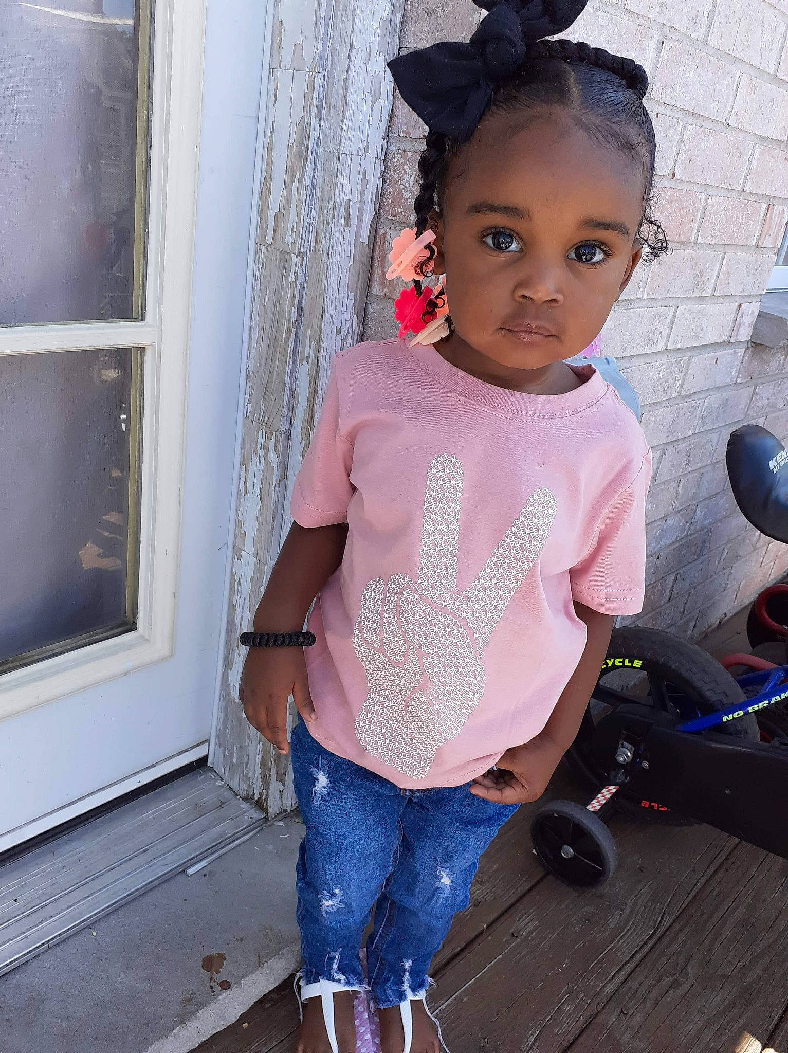 Raine is registered to the contest to win money with this photo: child, child_model, clothing, cool, denim, jeans, person, pink, shoe, shoulder, sleeve, t_shirt, textile, toddler, top, trousers