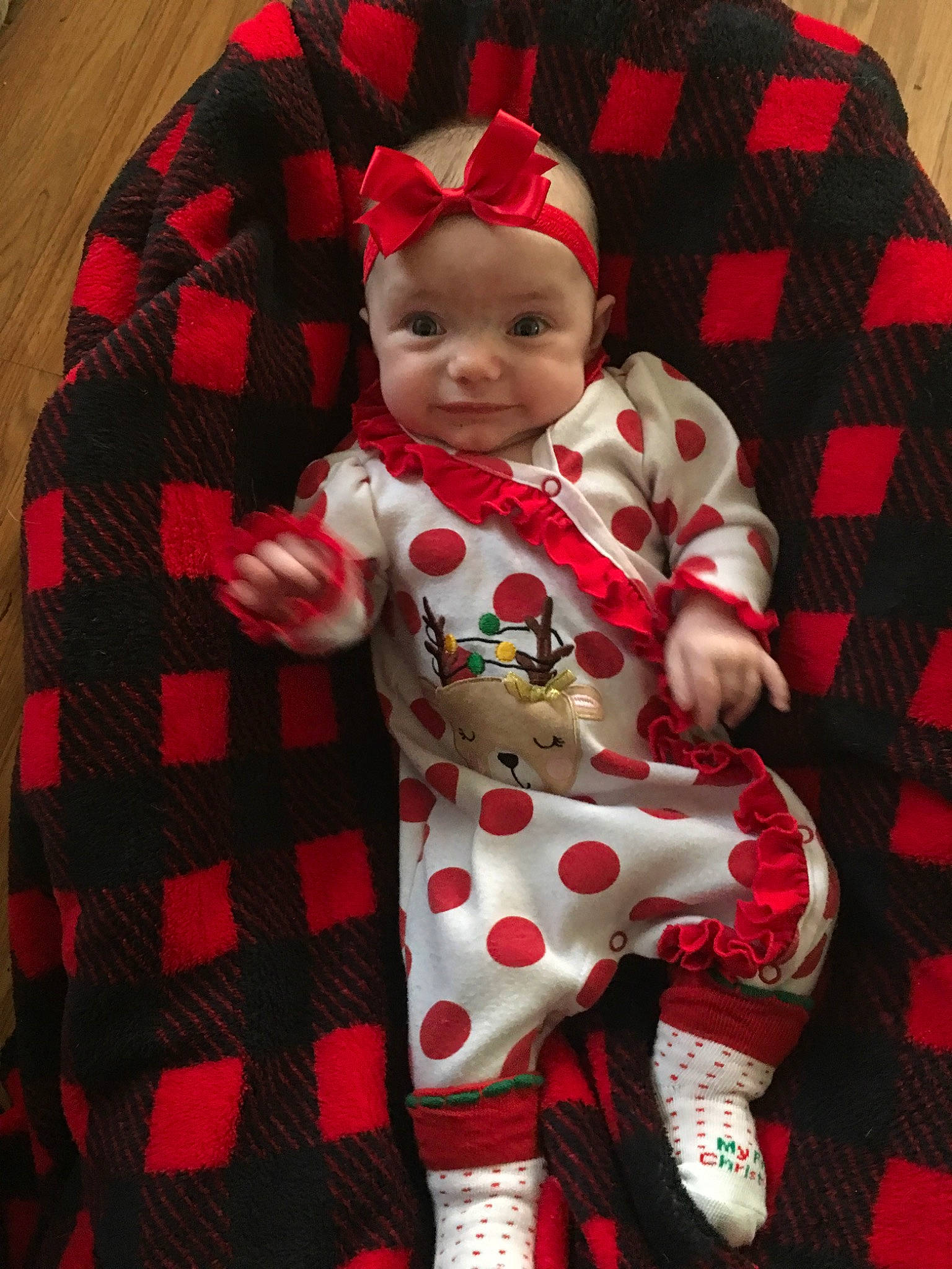 Ellie is registered to the contest to win money with this photo: baby, baby_toddler_clothing, child, christmas, design, pajamas, pattern, person, plaid, red, sleeve, textile, toddler