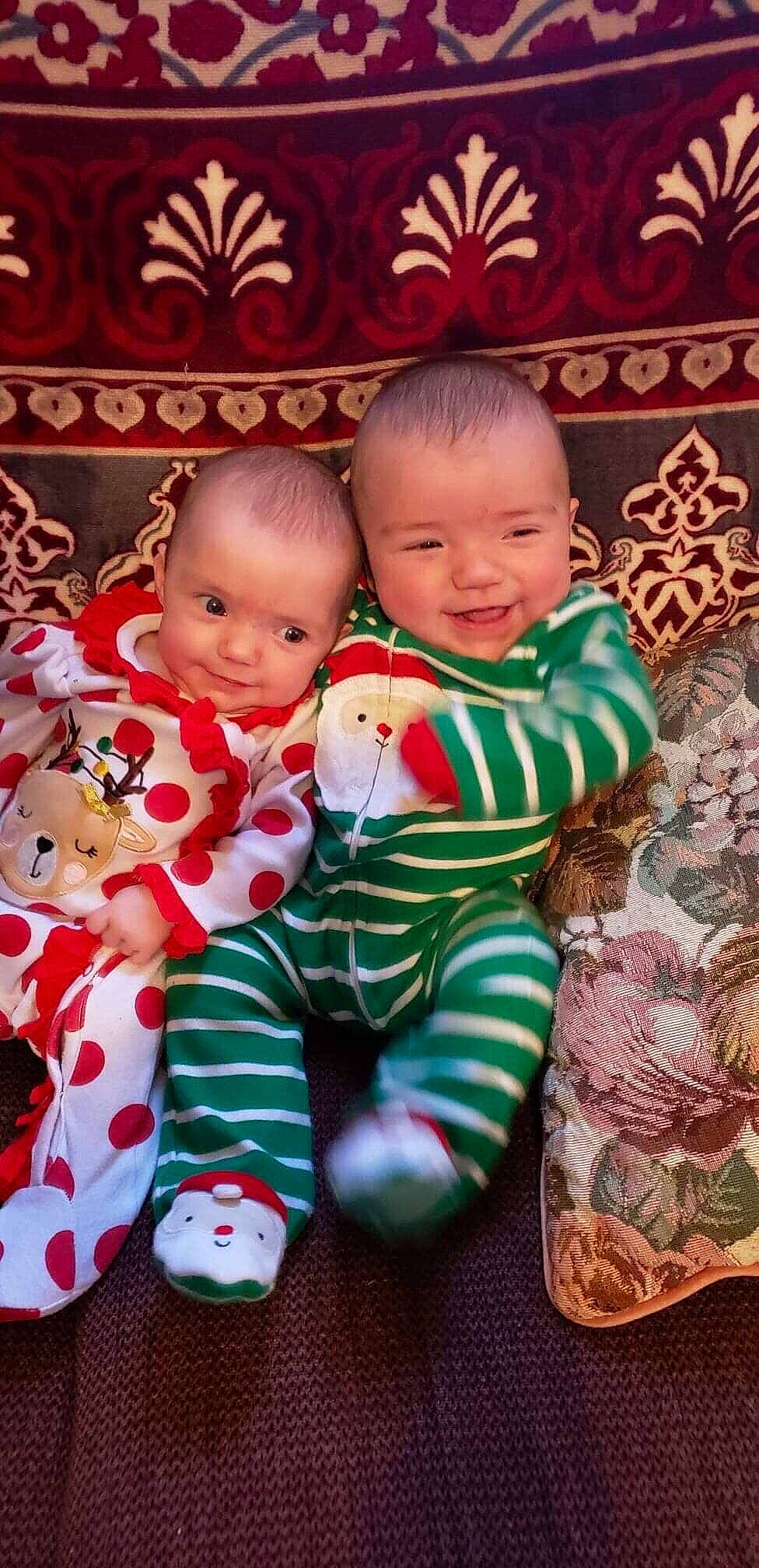 Ellie is registered to the contest to win money with this photo: baby, baby_toddler_clothing, child, christmas, christmas_eve, holiday, joy, person, sibling, toddler