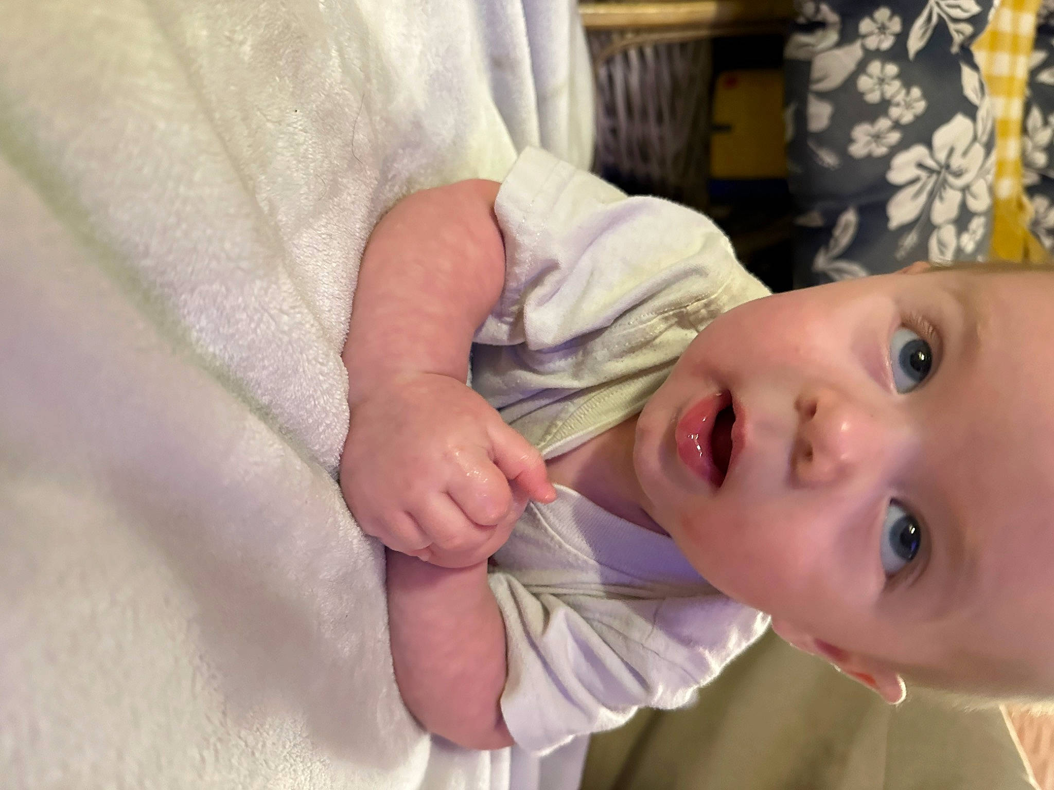 Forrest is registered to the contest to win money with this photo: baby, baby_toddler_clothing, cheek, child, comfort, dress, eyelash, gesture, hand, happy, iris, linens, lip, nose, person, plant, skin, sleeve, smile, toddler