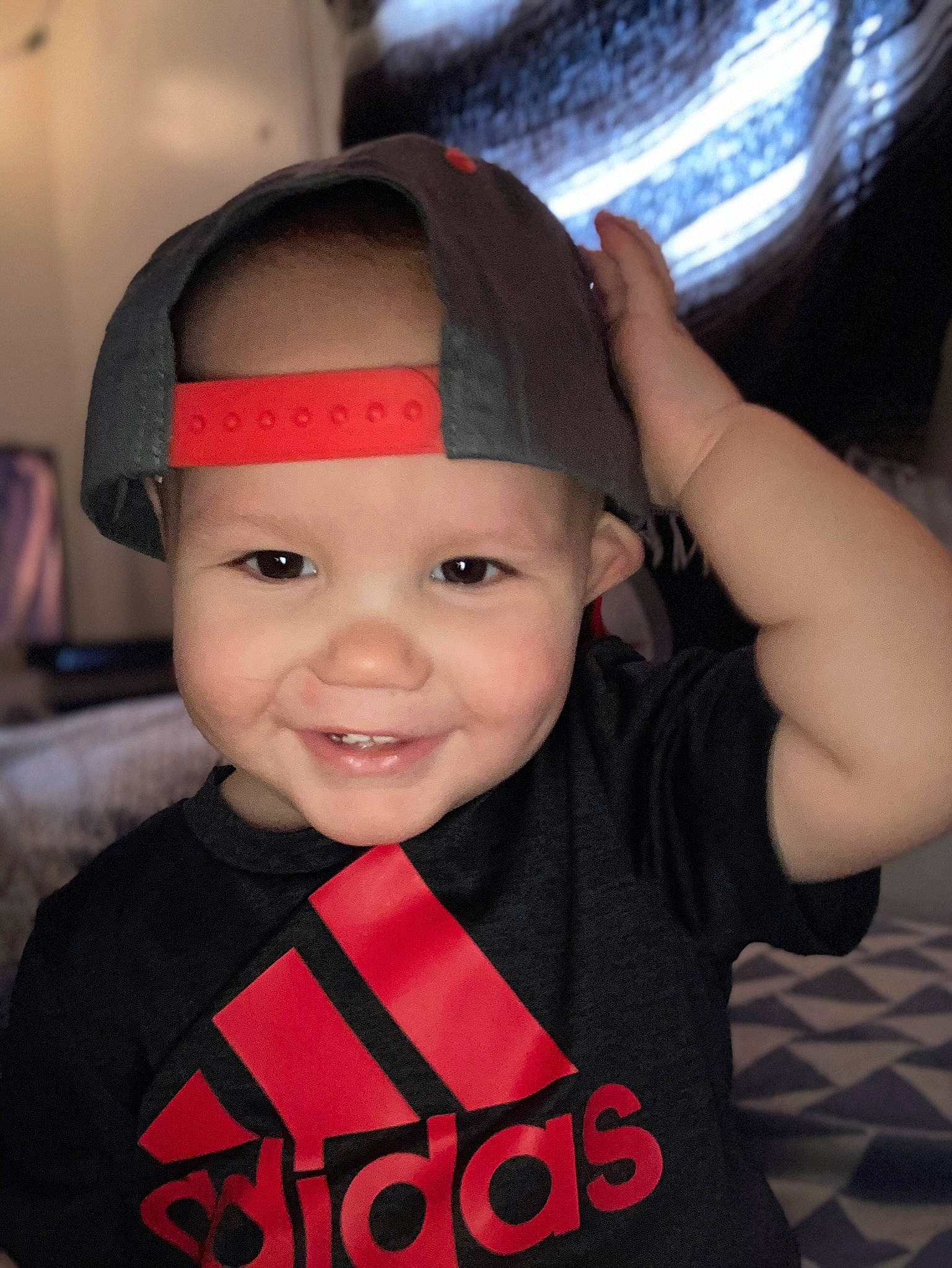 Izaiah is registered to the contest to win money with this photo: baby, baby_toddler_clothing, cap, cheek, chin, cool, electric_blue, eye, eyebrow, flash_photography, fun, happy, headgear, headwear, joy, lip, magenta, person, skin, sleeve