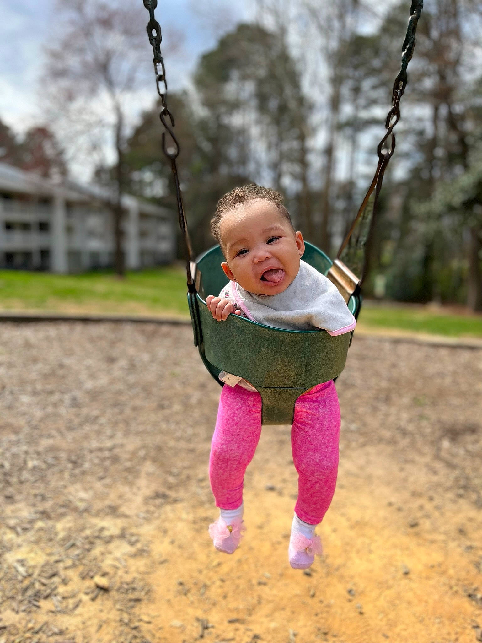 Samiraa is registered to the contest to win money with this photo: baby, baby_toddler_clothing, child, clothing, electric_blue, fun, grass, happy, head, leisure, outdoor_play_equipment, people_in_nature, person, plant, playground, recreation, sky, sleeve, swing, toddler