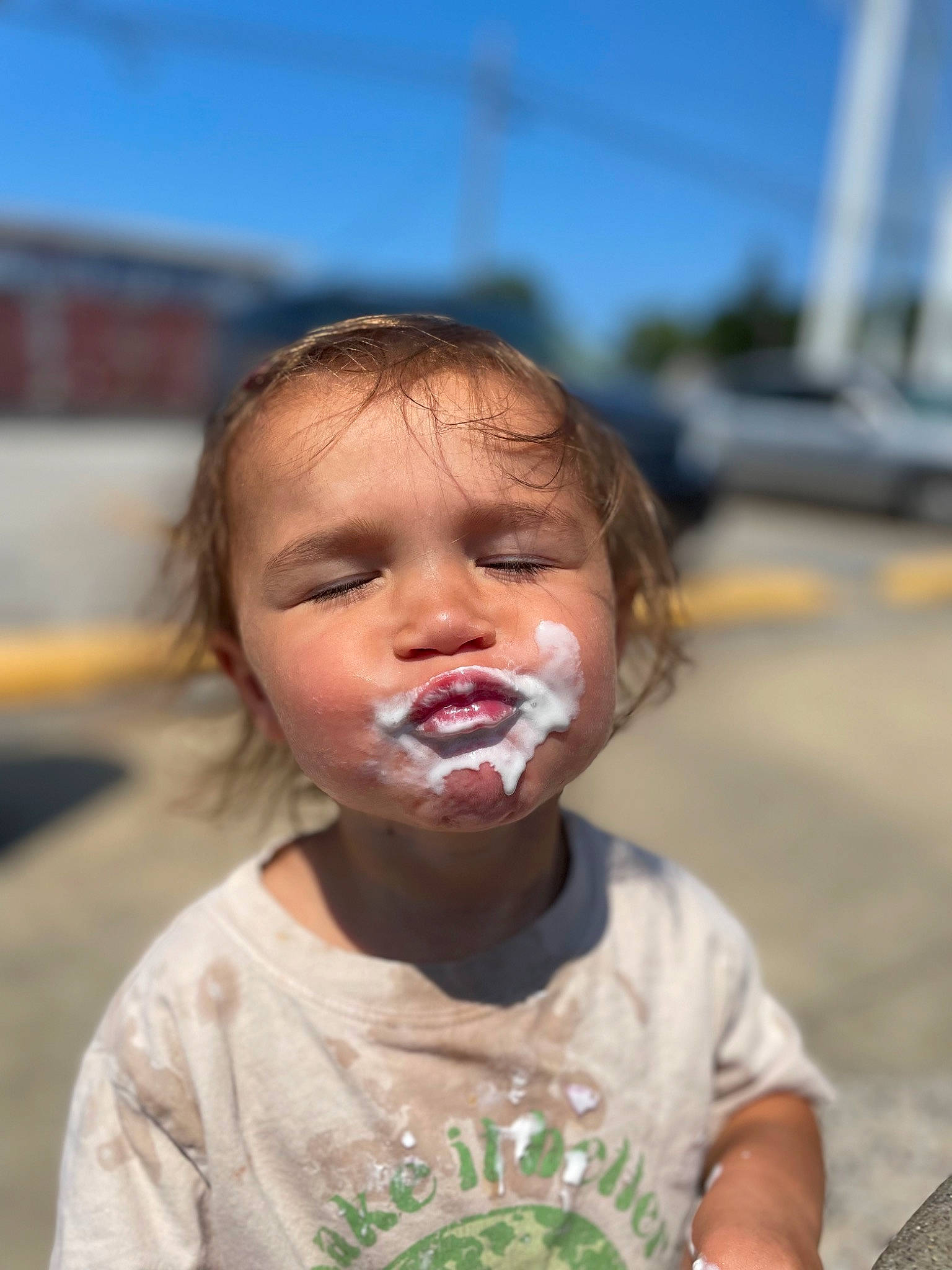 Rosalie is registered to the contest to win money with this photo: blond, cheek, chin, event, fun, gesture, grass, hair, happy, human_body, jaw, leisure, lip, mouth, nose, person, sky, t_shirt, toddler, tooth