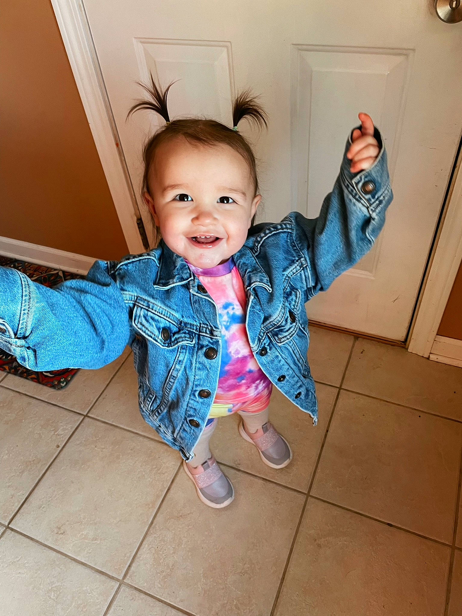 Rosalie joined the competition — help win amazing prizes! baby_toddler_clothing, cheek, finger, flash_photography, floor, flooring, fun, gesture, hairstyle, happy, human_body, joint, joy, nose, person, skin, sleeve, smile, standing, thumb
