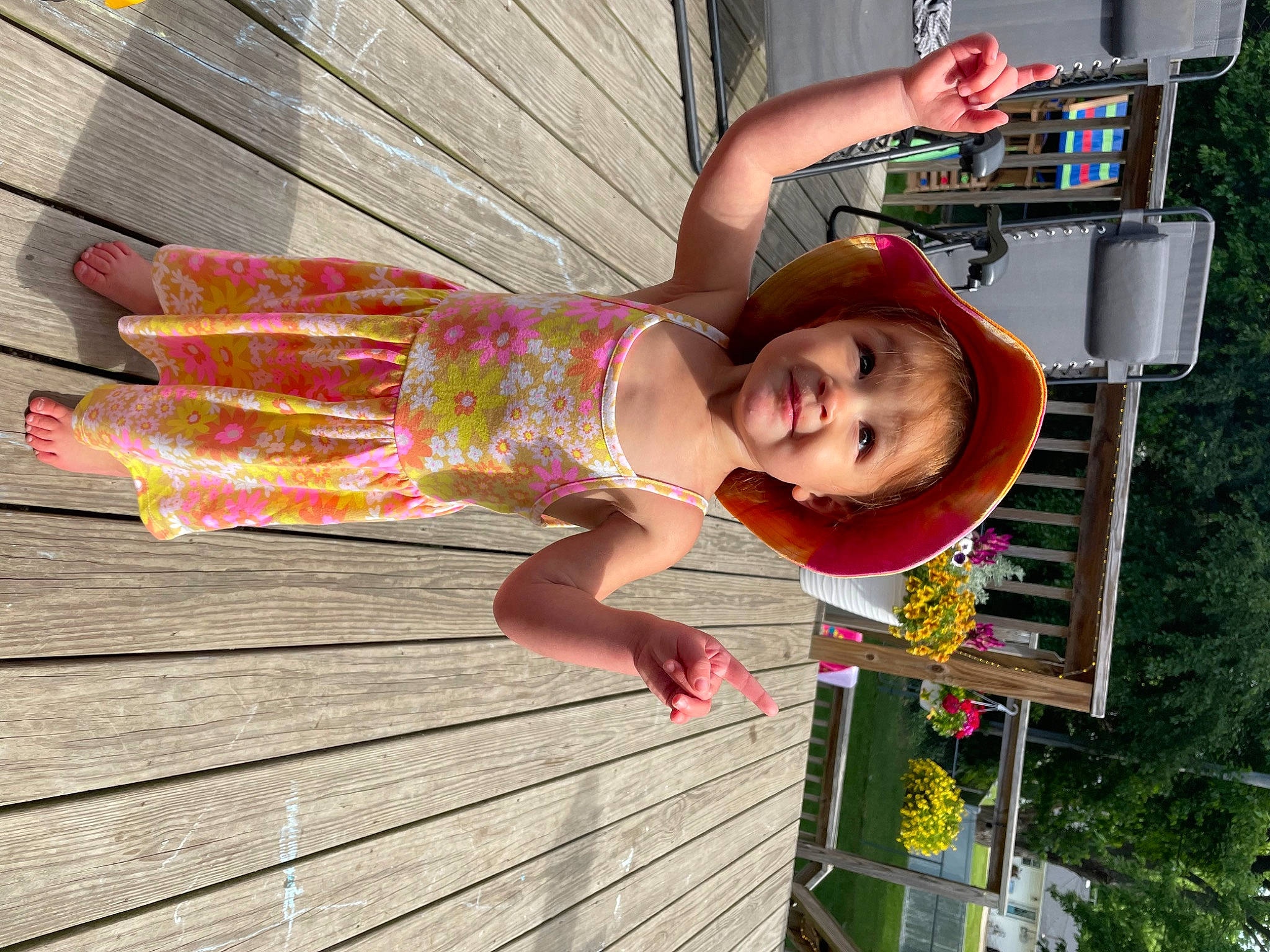 Rosalie is registered to the contest to win money with this photo: baby, baby_toddler_clothing, child, fun, happy, hardwood, hat, leisure, magenta, pattern, person, pink, play, recreation, sandal, smile, thigh, toddler, tree, vacation