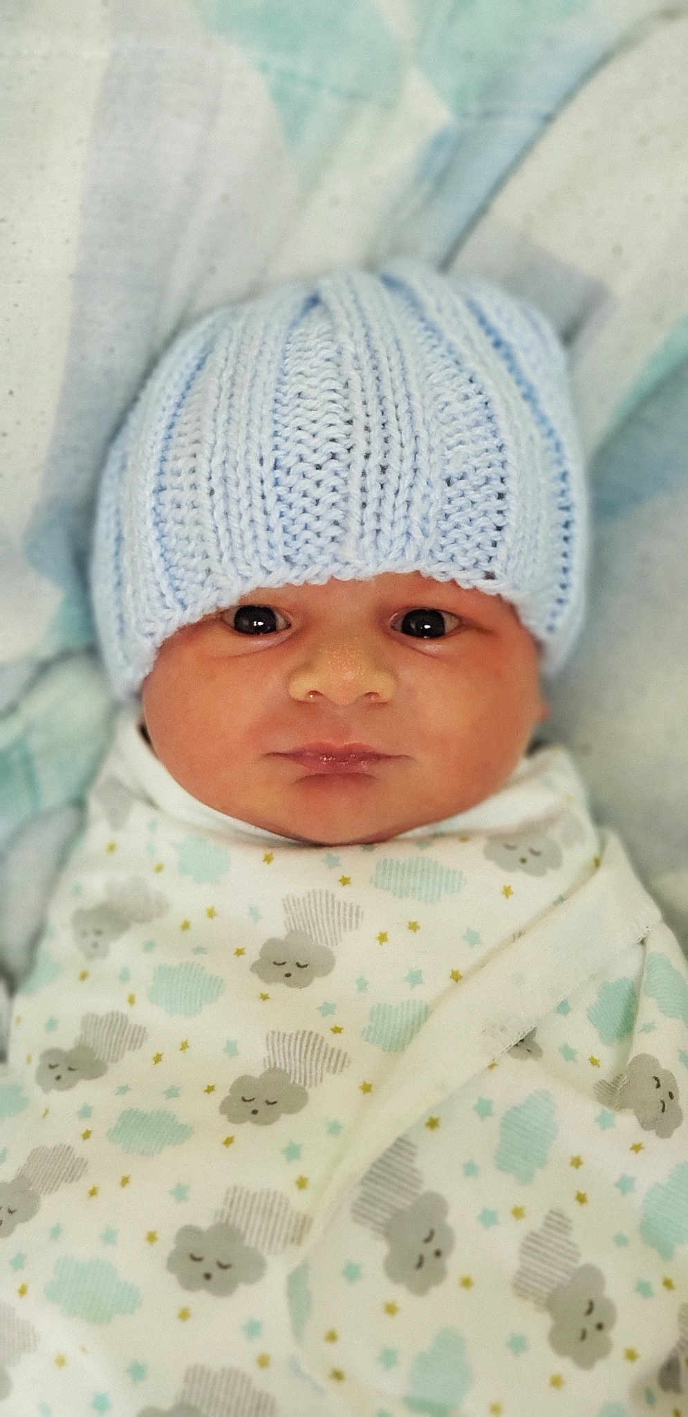Dante is registered to the contest to win money with this photo: baby, bonnet, cap, child, headgear, knit_cap, knitting, person, toddler, wool