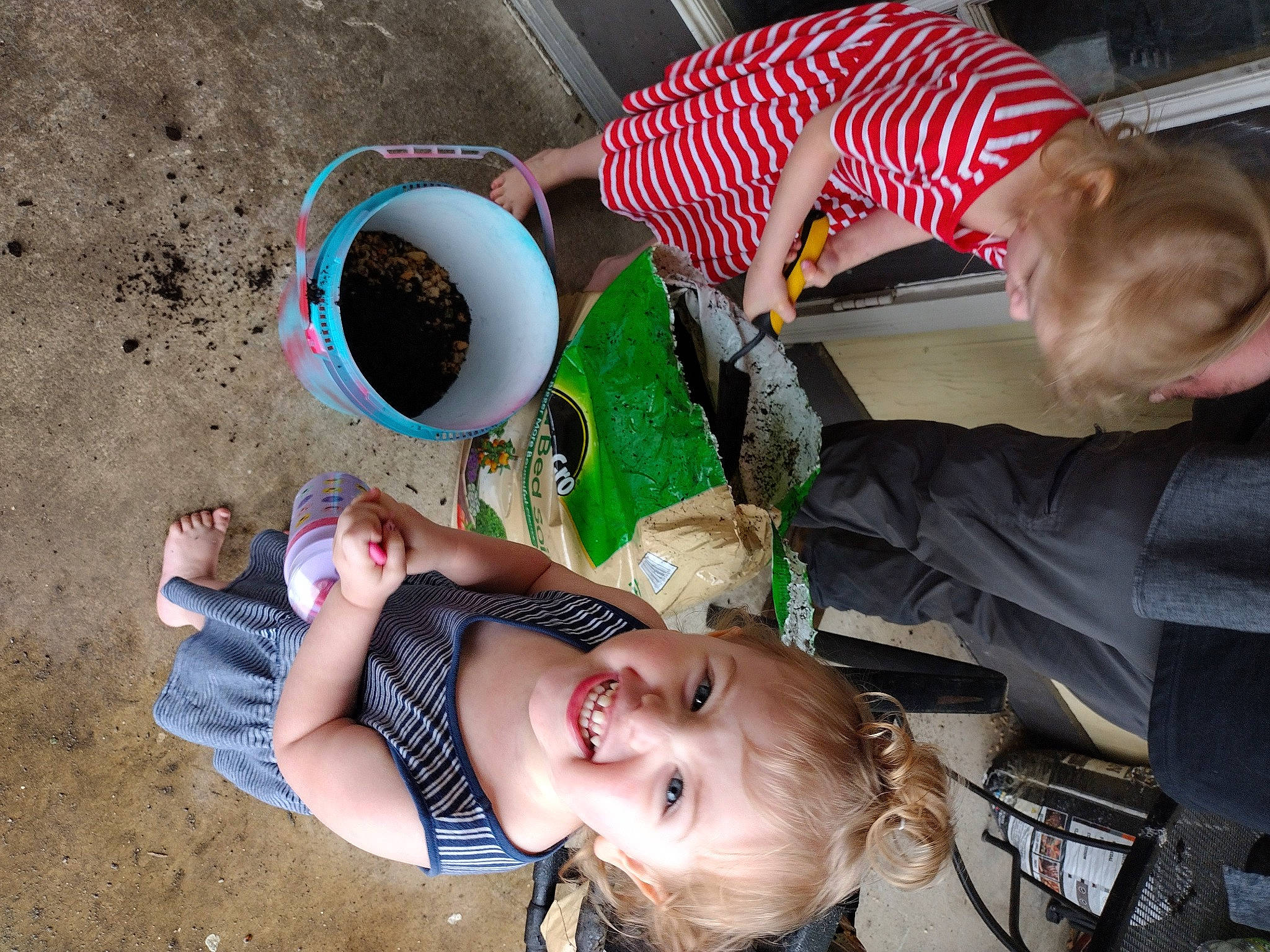 Shannon is registered to the contest to win money with this photo: baby, child, cup, event, eyewear, face, food, fun, grass, happy, hat, joy, leisure, mammal, person, recreation, sitting, soil, tableware, toddler
