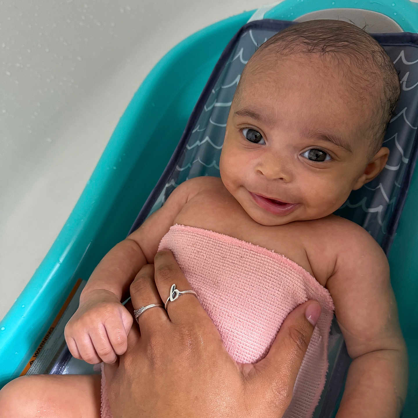 Blakelynn is registered to the contest to win money with this photo: accessories, baby, bathing, bathtub, bodypart, clothing, dress, face, finger, hand, happy, head, jewelry, necklace, newborn, person, photography, portrait, smile, tub