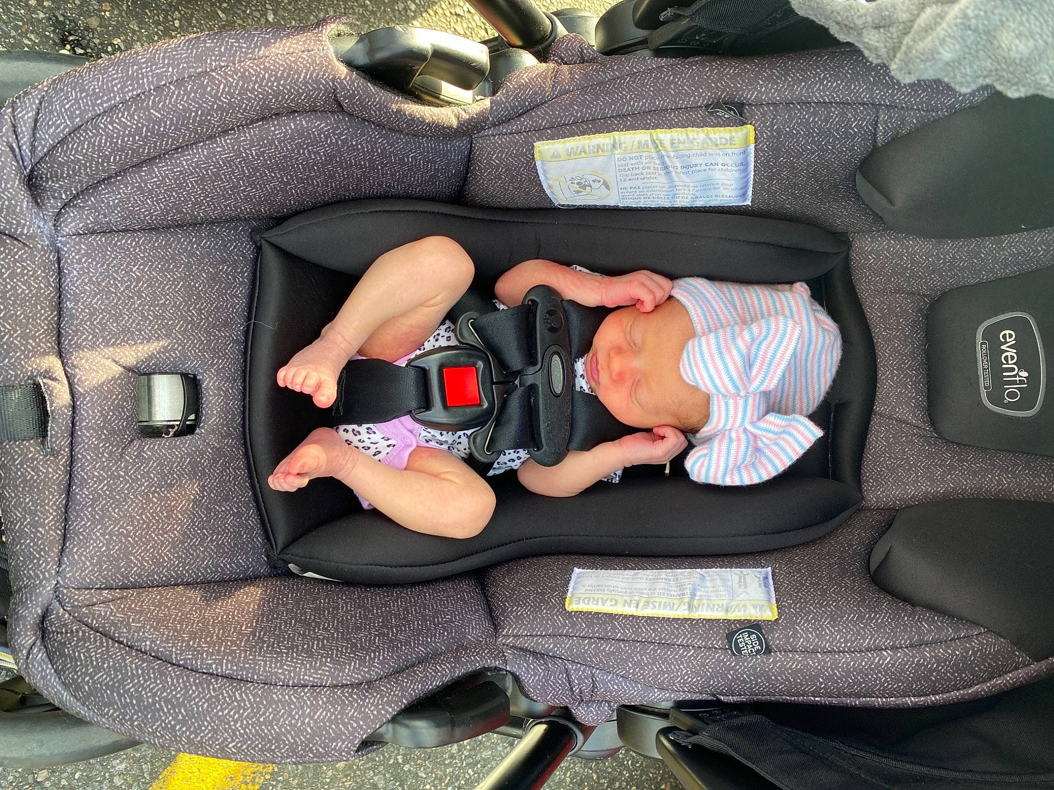 Layla joined the competition — help win amazing prizes! auto_part, baby, baby_carriage, baby_products, baby_safety, baby_toddler_clothing, bag, baggage, car_seat, child, comfort, fashion_accessory, grass, headwear, lap, luggage_and_bags, person, sitting, toddler