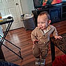 Elias joined the competition — help win amazing prizes! toddler, child, indoor, living_room, table, television, flooring, sneakers, clothing, smiling, furniture, person, basket, door, footwear, marble, wooden_floor, candid, home, action