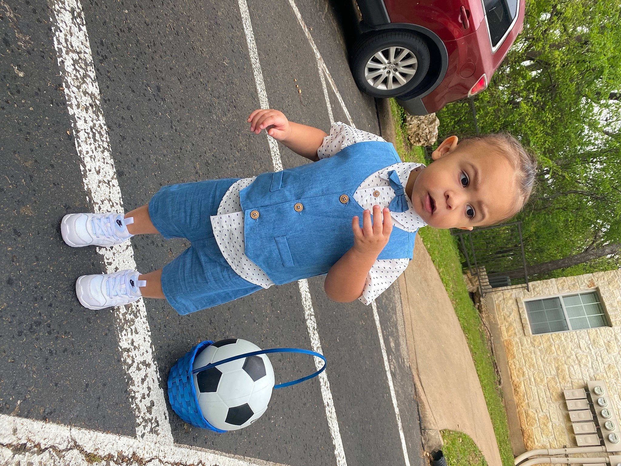Darius joined the competition — help win amazing prizes! automotive_tire, ball, car, fender, football, fun, grass, leisure, motor_vehicle, person, plant, red, soccer, sports, sports_equipment, tire, toddler, tree, vehicle, wheel