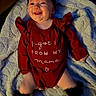 Willow joined the competition — help win amazing prizes! baby, infant, child, smiling, happy, portrait, lying_down, blanket, red_outfit, black_headband, bow, baby_clothing, indoor, cozy, close_up, face, eyes, hands, legs, family_message