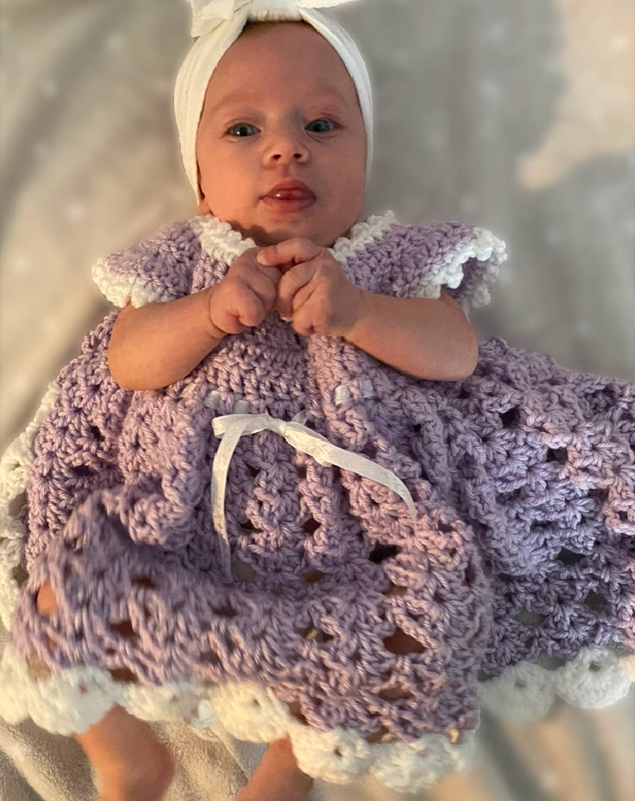 Braelynn is registered to the contest to win money with this photo: baby_toddler_clothing, beauty, child, dress, eye, face, fashion_design, gesture, happy, head, headgear, human_body, neck, organ, pattern, person, skin, sleeve, toddler, wool