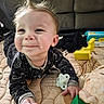 baby, child, smile, spiky_hair, pacifier, toy_blocks, plush_toy, mat, couch, indoor, happy, infant, clothing, face, hand, playtime, cute, person, floor, expression