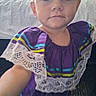 child, portrait, selfie, purple_dress, lace, indoor, bed, carpet, young_child, face, person, cute, looking_at_camera, short_hair, closeup, colorful_clothing, toddler, baby, casual, home