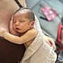 arm, baby, blanket, chest, closeup, comfort, cuddle, human, indoor, infant, love, newborn, parent, peaceful, person, resting, skin, sleeping, soft, tenderness