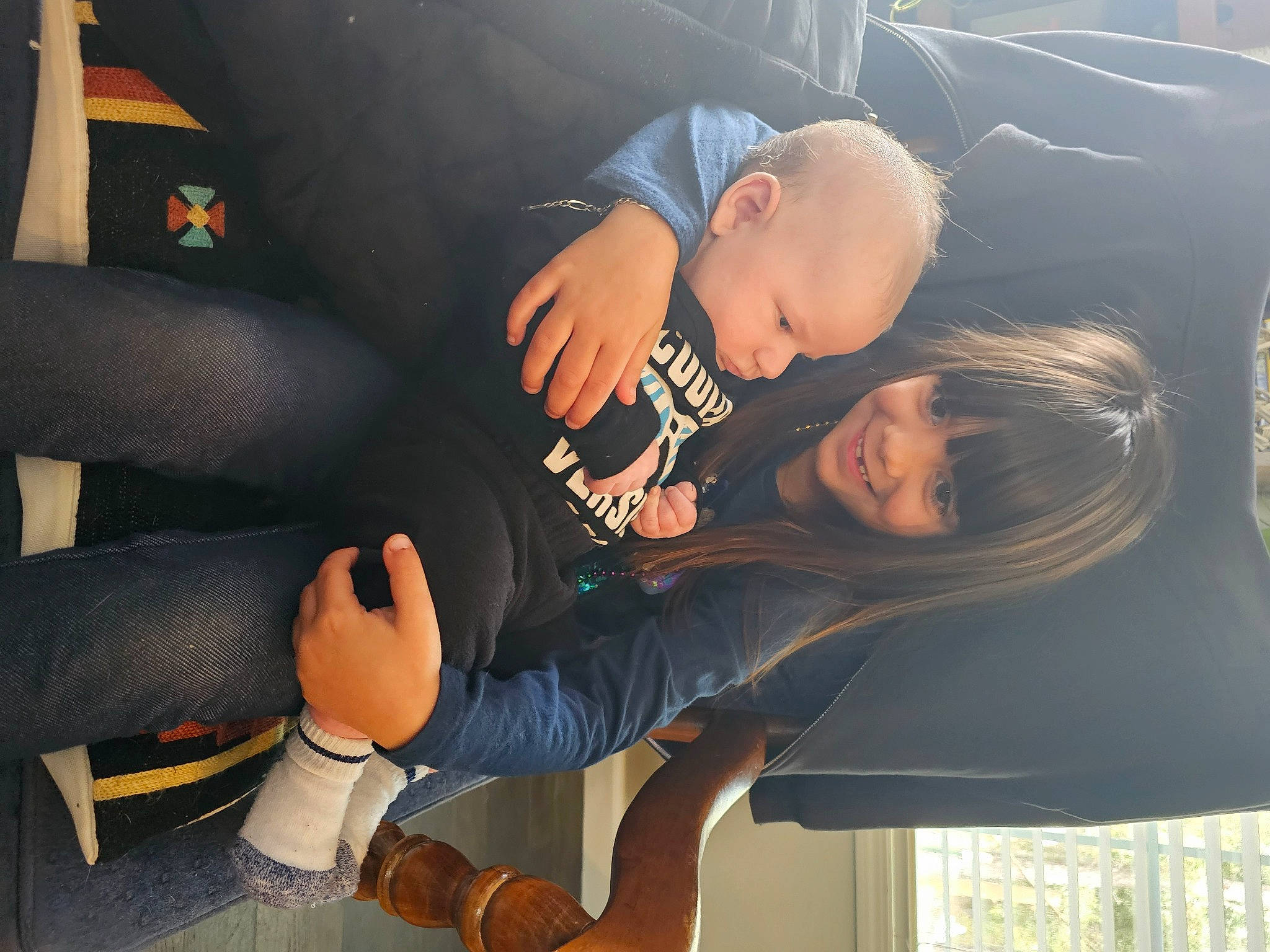 Ariyana is registered to the contest to win money with this photo: auto_part, automotive_design, black_hair, car_seat, child, comfort, elbow, family_car, fun, gesture, happy, human_leg, joy, lap, luxury_vehicle, mouth, person, sitting, thigh, toddler