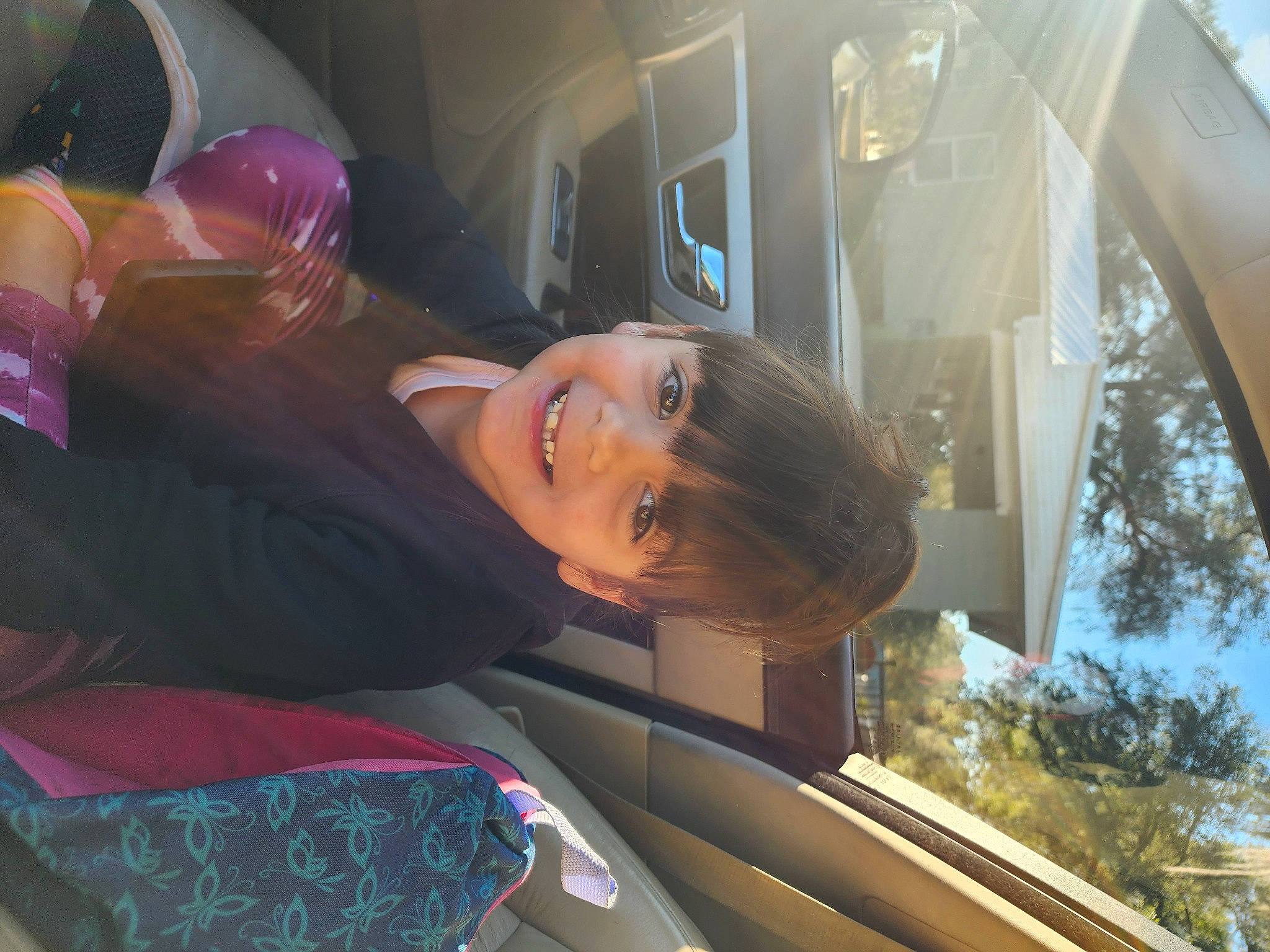 Ariyana joined the competition — help win amazing prizes! auto_part, automotive_design, automotive_exterior, automotive_lighting, automotive_wheel_system, automotive_window_part, eyewear, family_car, fun, glass, joy, leisure, luxury_vehicle, magenta, motor_vehicle, person, reflection, sunglasses, toy, tree