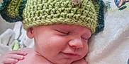 Jaxon-John joined the competition — help win amazing prizes! baby, sleeping, hat, crocheted, dinosaur, green, blanket, smile, peaceful, infant, cute, child, soft, relaxing, hand, skin, portrait, indoors, cozy, headwear