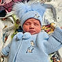 Jaxon-John joined the competition — help win amazing prizes! baby, infant, sleeping, hat, knitted_clothing, pom_pom, blue_outfit, bunny_embroidery, blanket, cartoon, cute, cozy, child, portrait, indoors, soft_light, peaceful, newborn, warm, resting
