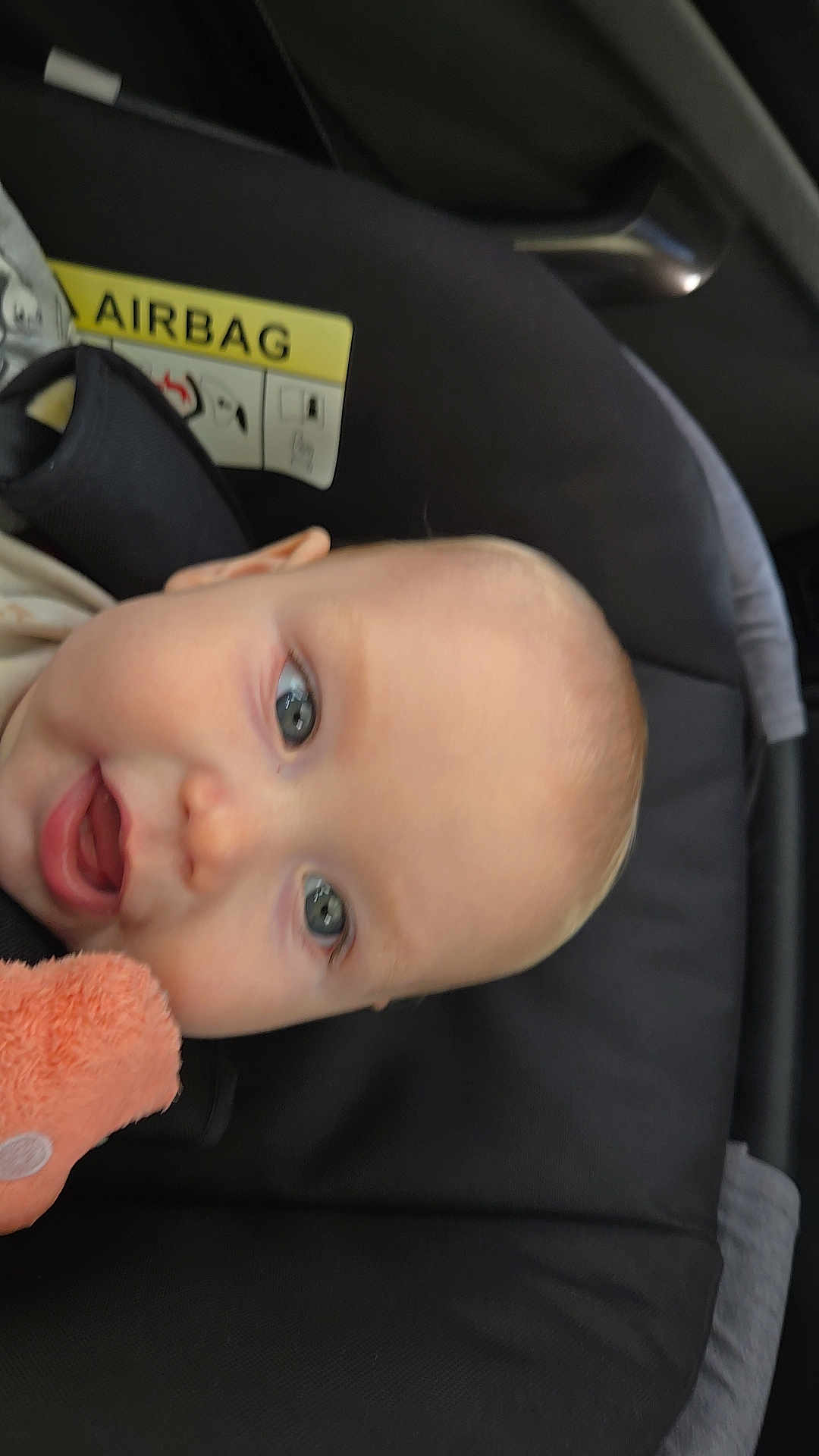 Thomas is registered to the contest to win money with this photo: baby, child, car_seat, face, blue_eyes, plush_toy, infant, safety, car_interior, head, cute, young_child, seatbelt, car, child_safety, infant_toy, portrait, close_up, expression, seat