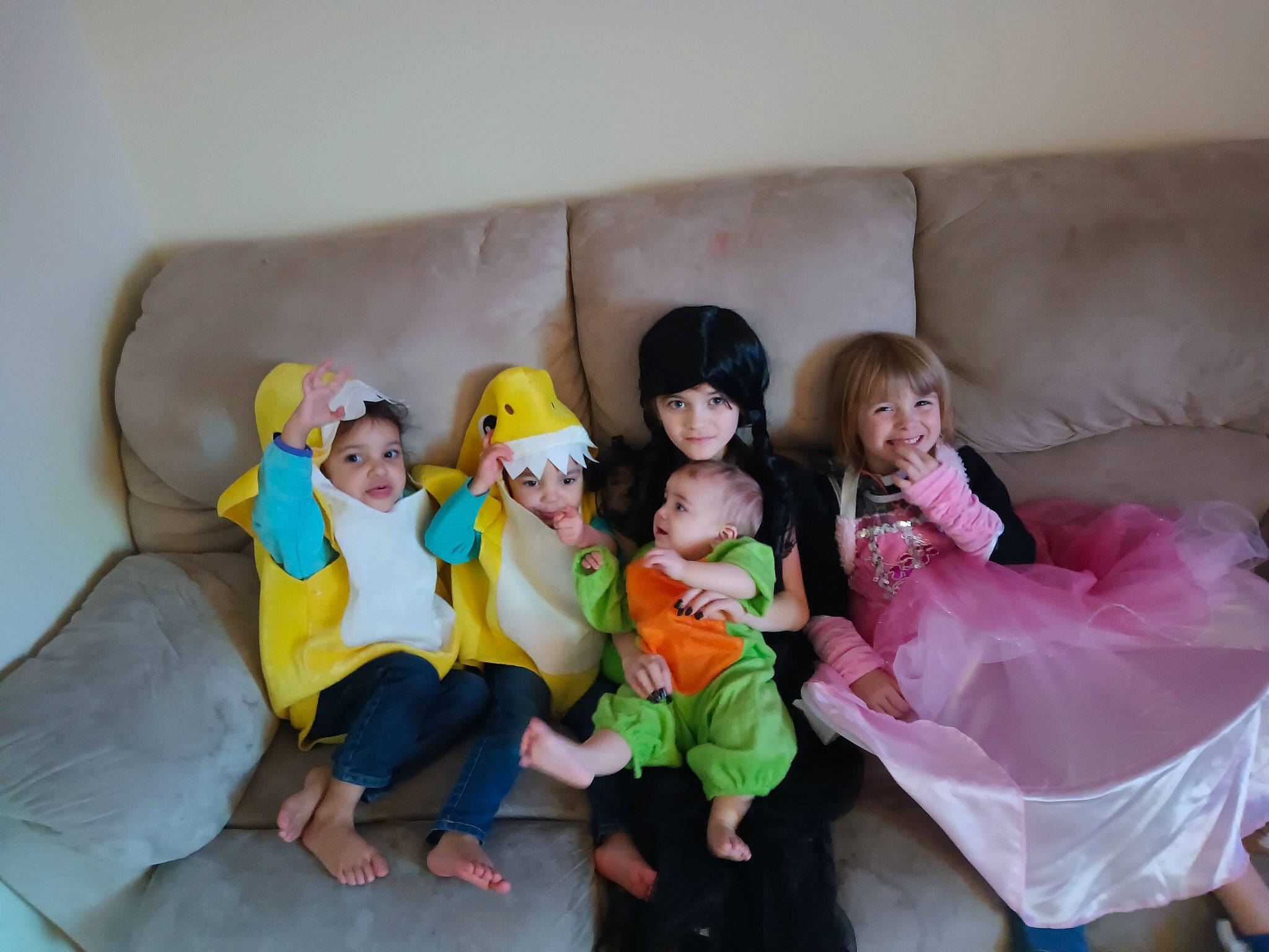 Brieanna is registered to the contest to win money with this photo: baby, child, comfort, couch, event, flooring, fun, happy, headwear, joy, lap, leisure, linens, living_room, person, pillow, room, shorts, sitting, sofa_bed