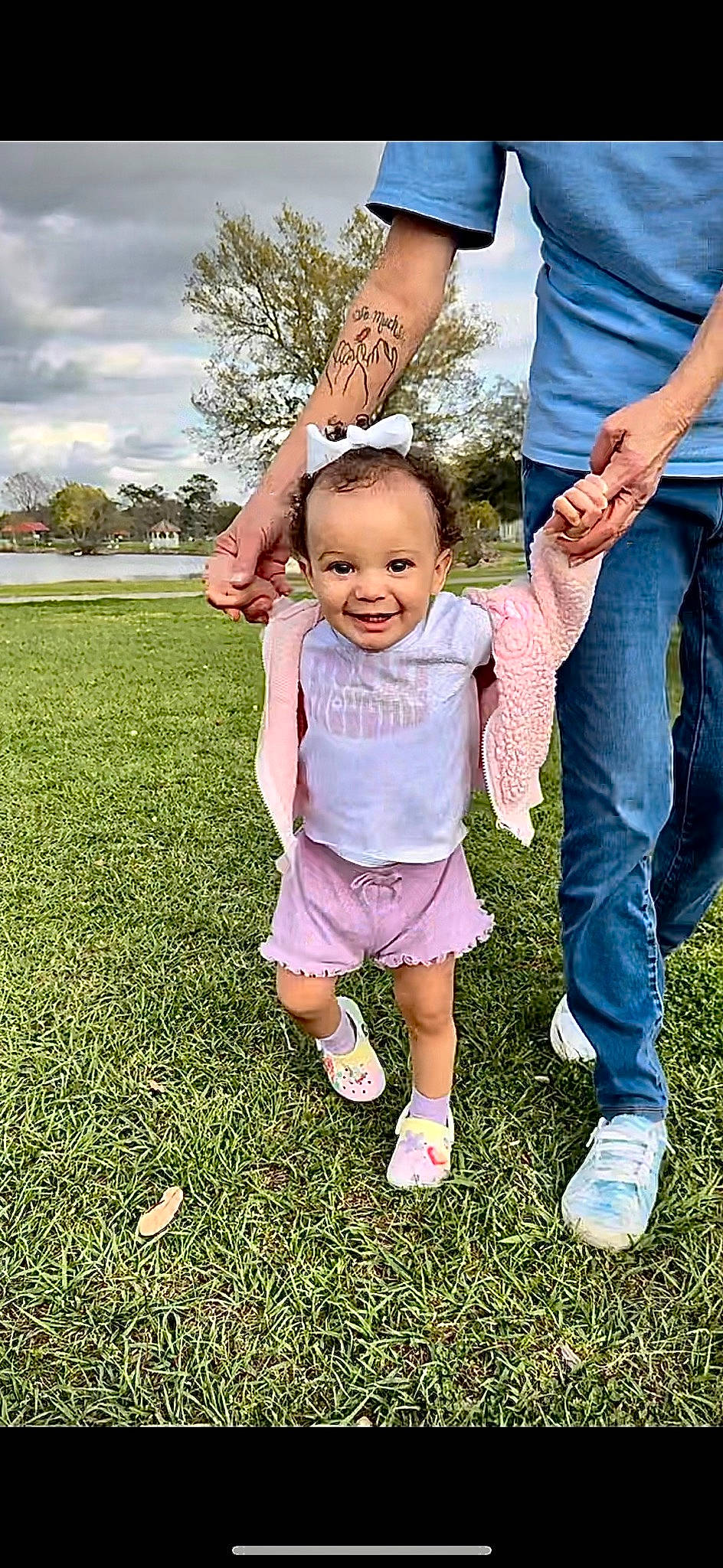 Maliyah joined the competition — help win amazing prizes! arm, baby_toddler_clothing, child, finger, footwear, fun, gesture, grass, hand, happy, jeans, joy, leisure, people, people_in_nature, person, plant, sky, smile, summer