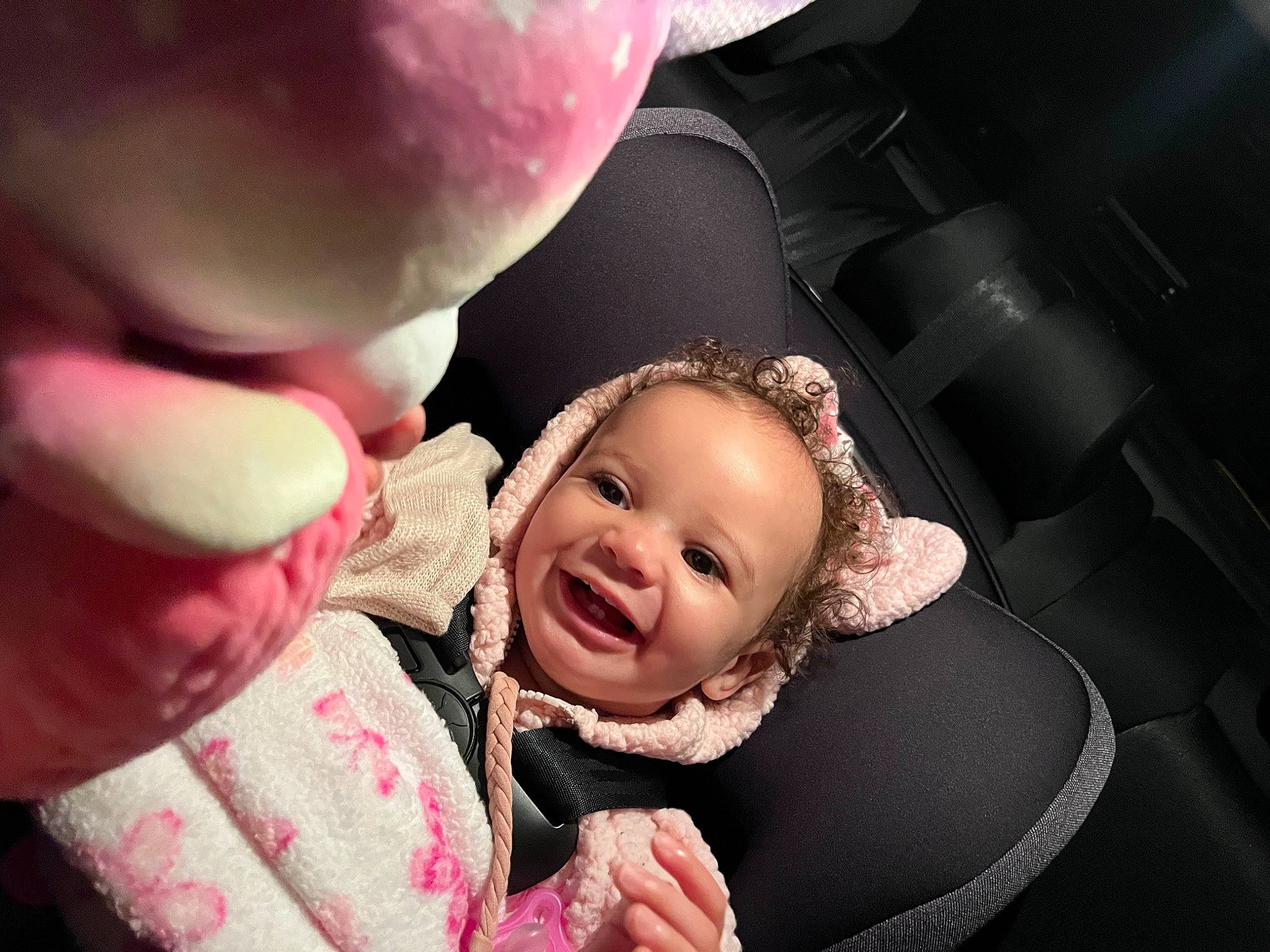 Maliyah is registered to the contest to win money with this photo: baby, baby_toddler_clothing, cheek, child, event, facial_expression, flash_photography, fun, gesture, happy, interaction, joy, lip, mouth, nose, person, pink, playing_with_kids, skin, smile