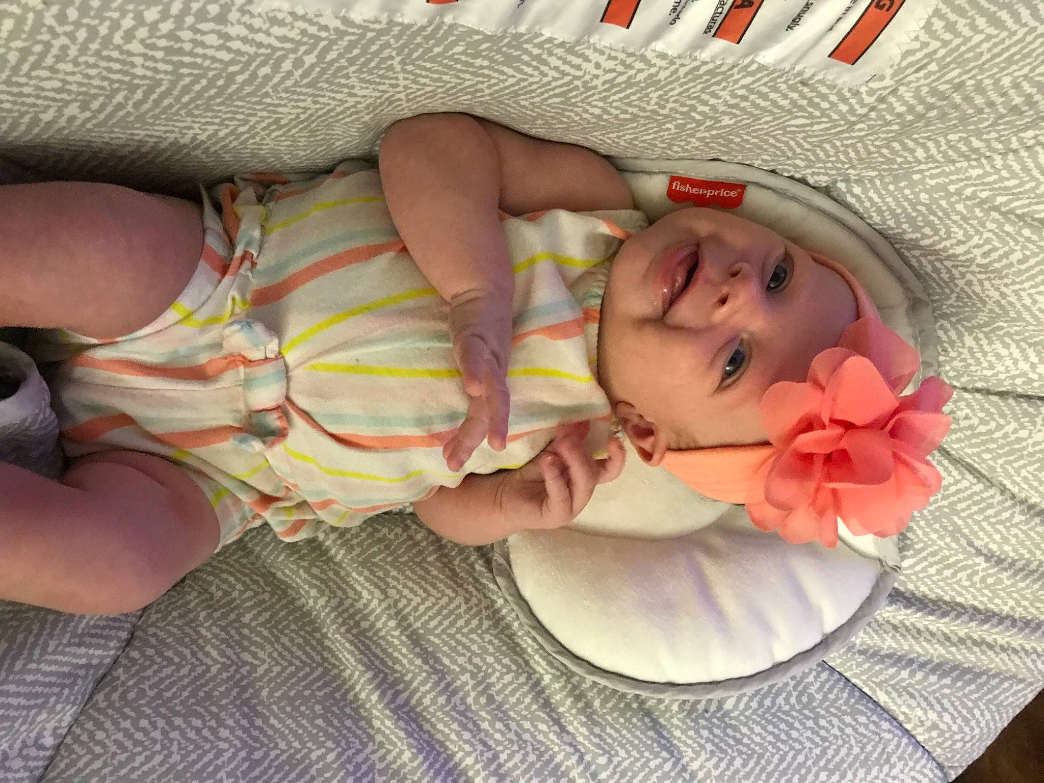 Everleigh is registered to the contest to win money with this photo: baby, baby_toddler_clothing, cheek, comfort, eye, facial_expression, finger, flower, head, headgear, headwear, human_body, lip, mouth, nail, person, petal, pink, skin, thigh