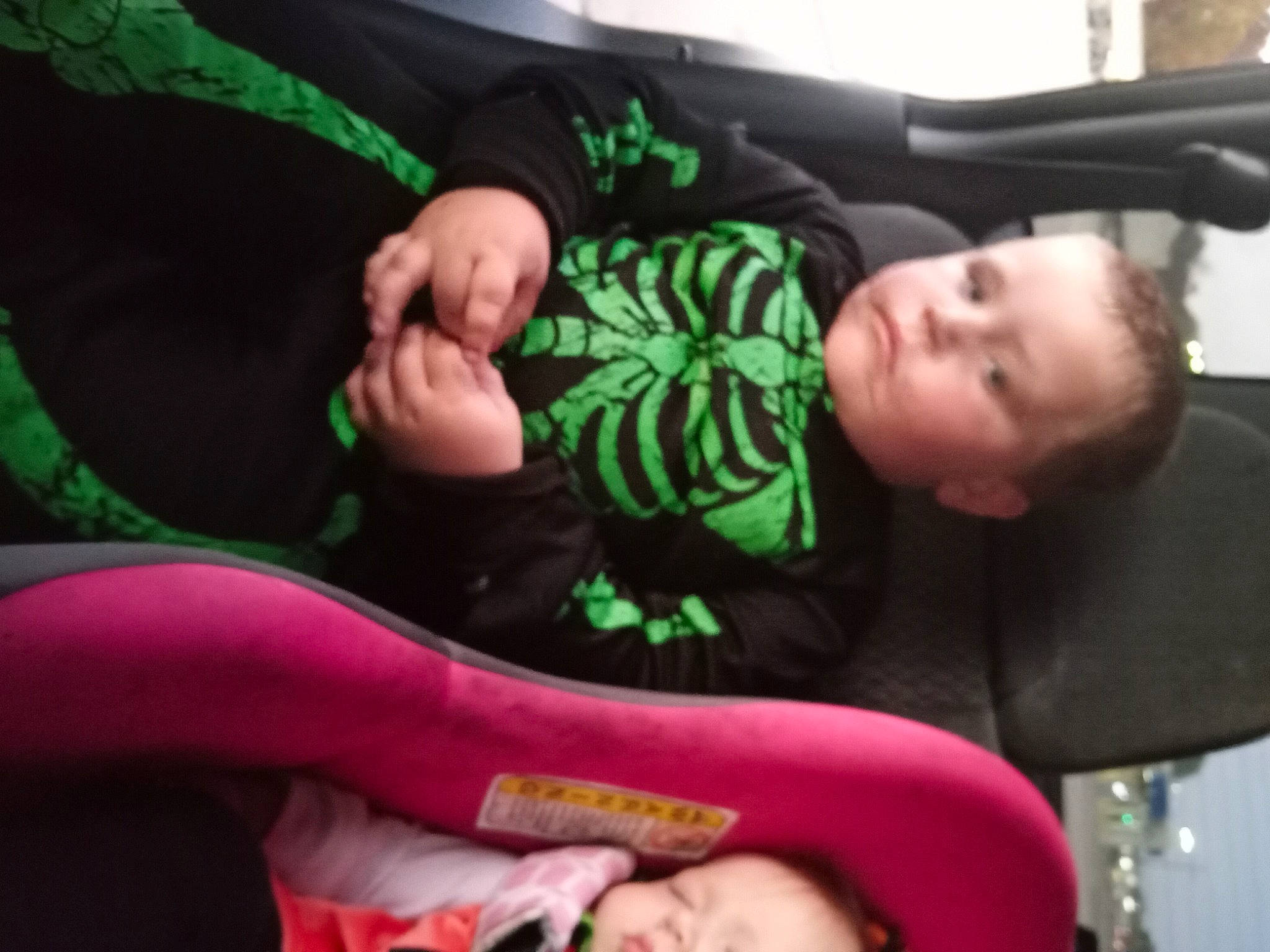 Jaxtin is registered to the contest to win money with this photo: baby, child, comfort, elbow, event, finger, fun, gesture, green, human_leg, joint, knee, lap, nail, person, room, sitting, thigh, thumb, toddler