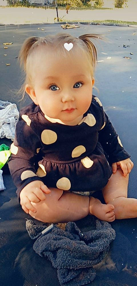 Nova is registered to the contest to win money with this photo: baby_toddler_clothing, blond, brown_hair, cheek, child, doll, eye, eyelash, happy, head, human_body, human_leg, iris, pattern, person, pink, skin, sleeve, thigh, toddler