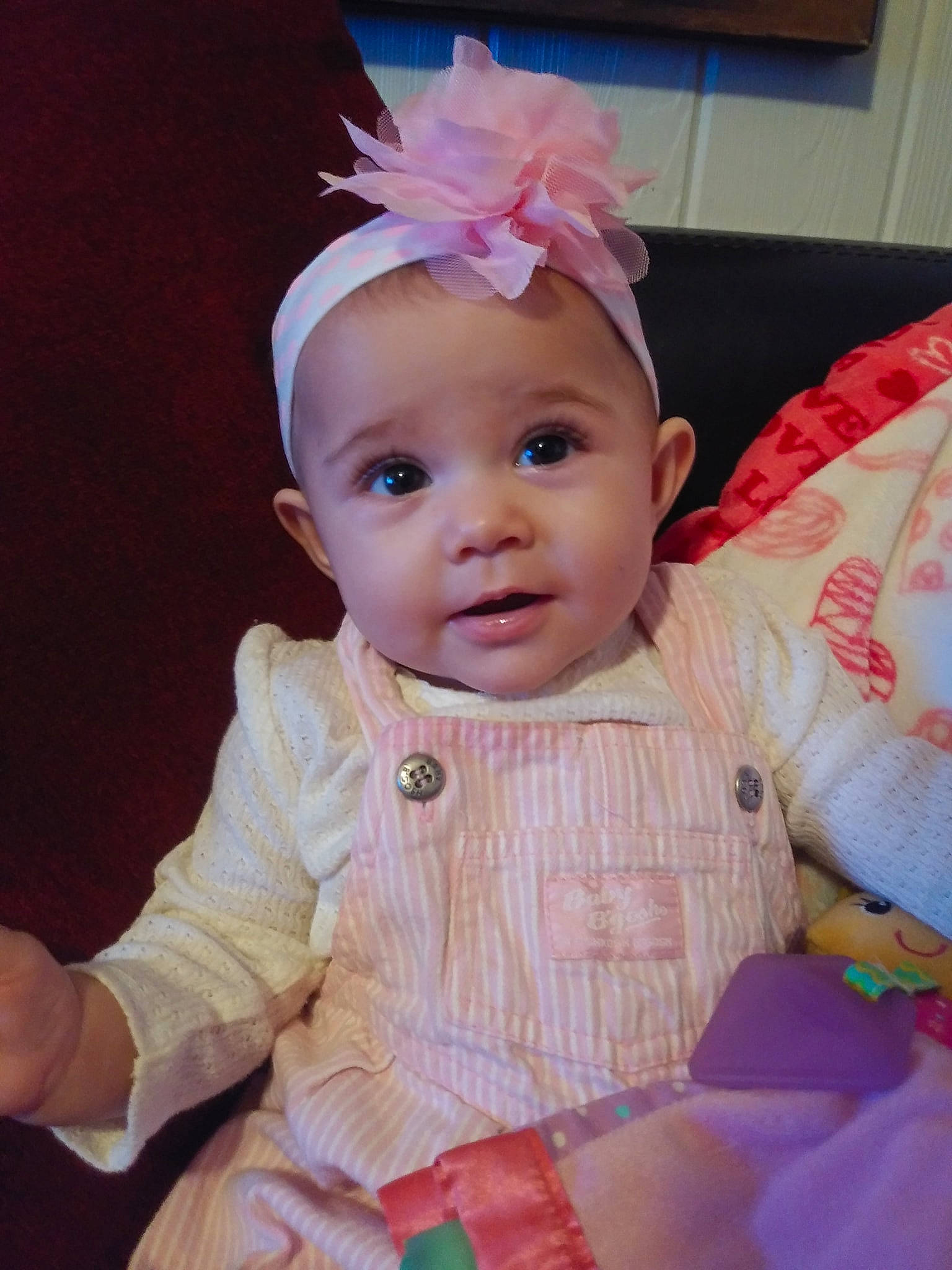 Camilla is registered to the contest to win money with this photo: baby, baby_toddler_clothing, cheek, child, ear, face, fashion_accessory, hair_accessory, head, headband, headgear, iris, person, pink, skin, smile, toddler