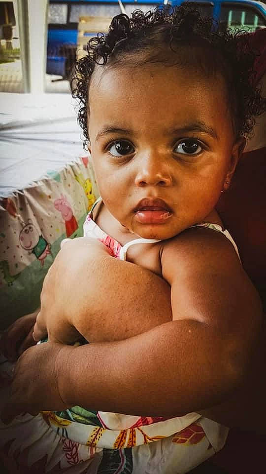 Amari is registered to the contest to win money with this photo: baby, cheek, chin, elbow, eye, eyebrow, eyelash, face, flash_photography, gesture, hair, happy, head, human_body, iris, lip, mouth, nose, person, skin